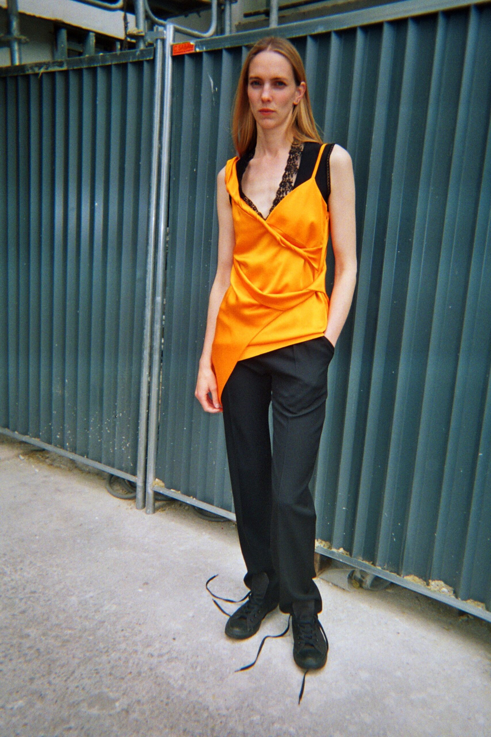 orange silk sleeveless v-neck fitted draped top
