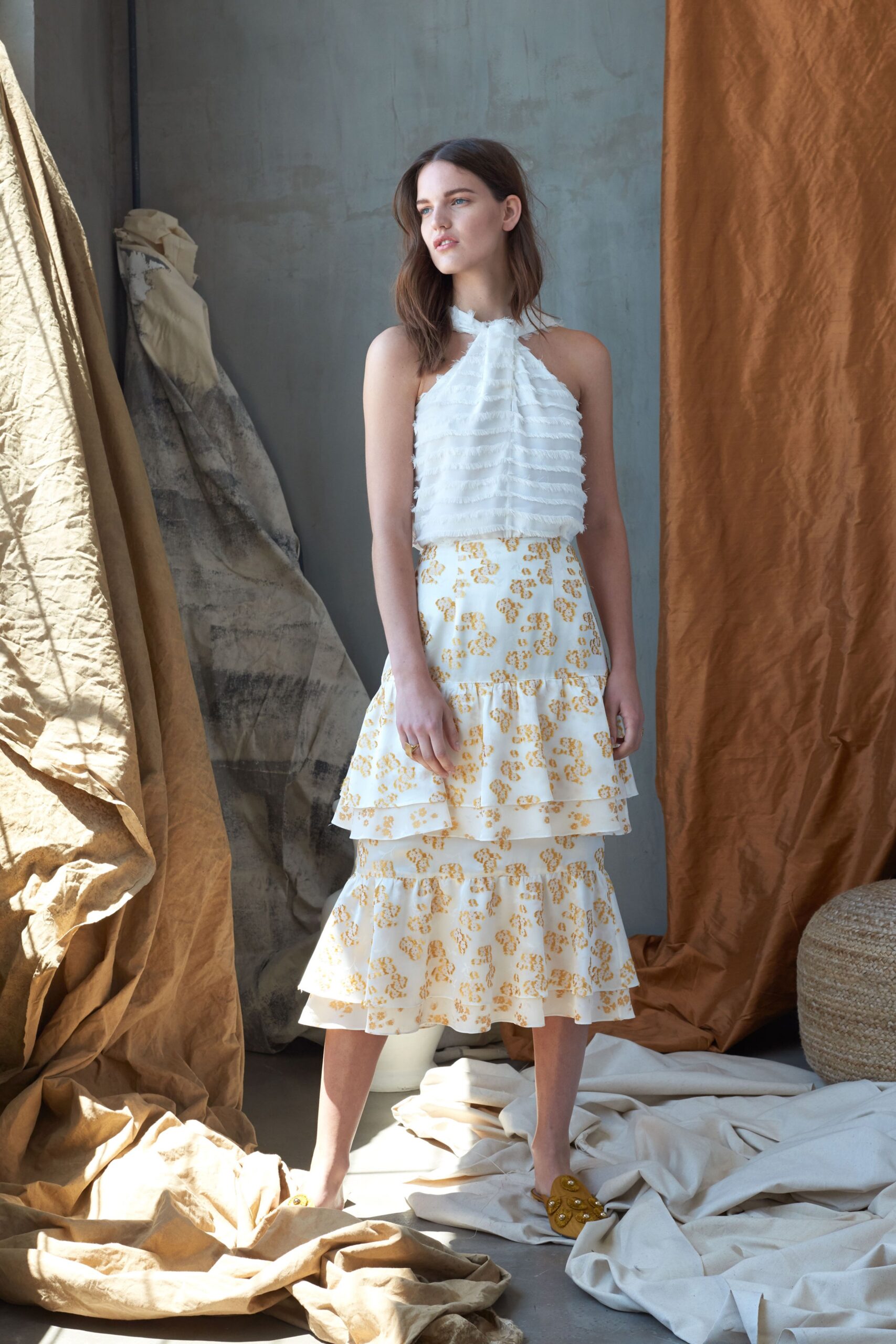 white ruffled top and tiered skirt