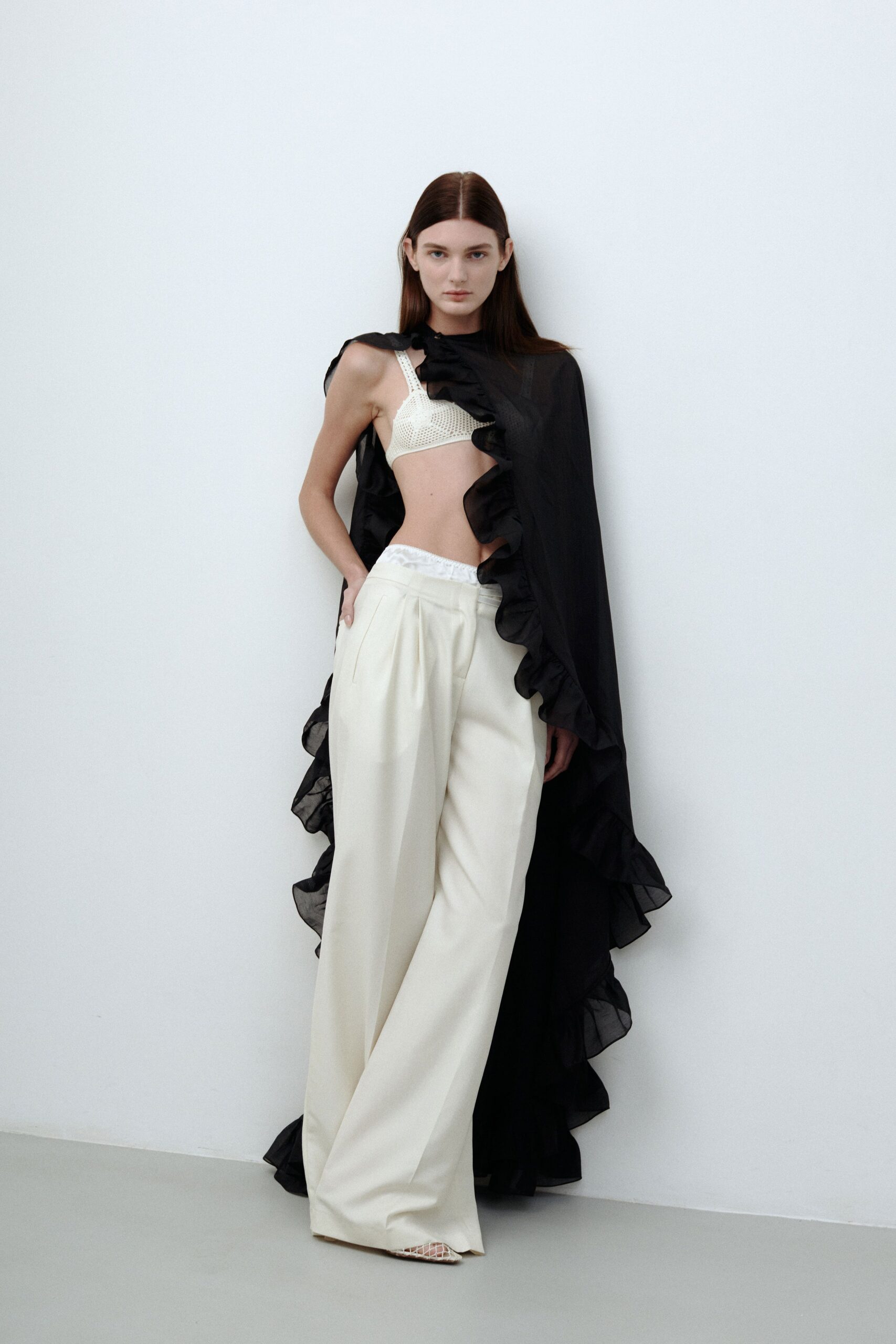 black chiffon cape with white pants