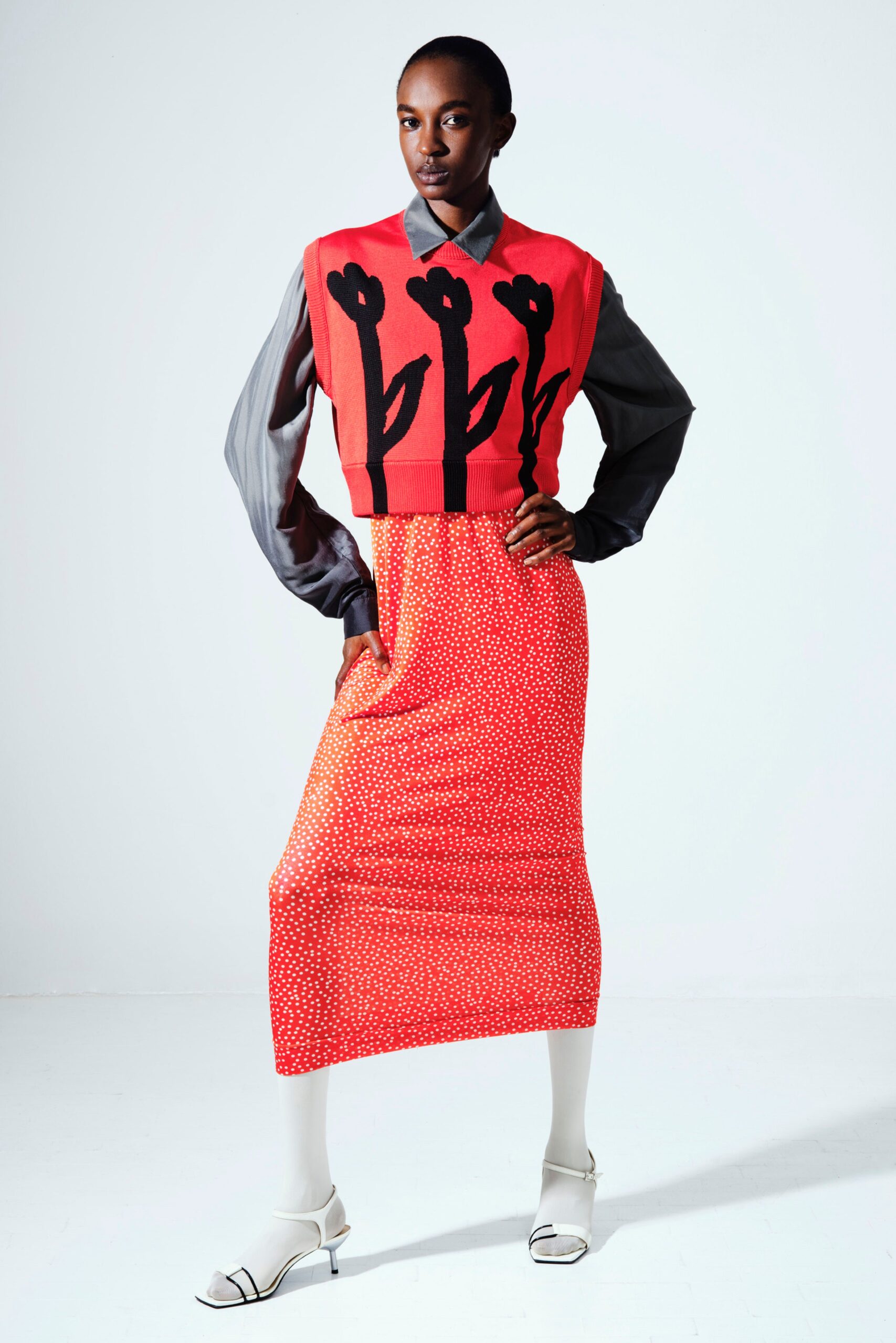 red embroidered sleeveless top with midi dress