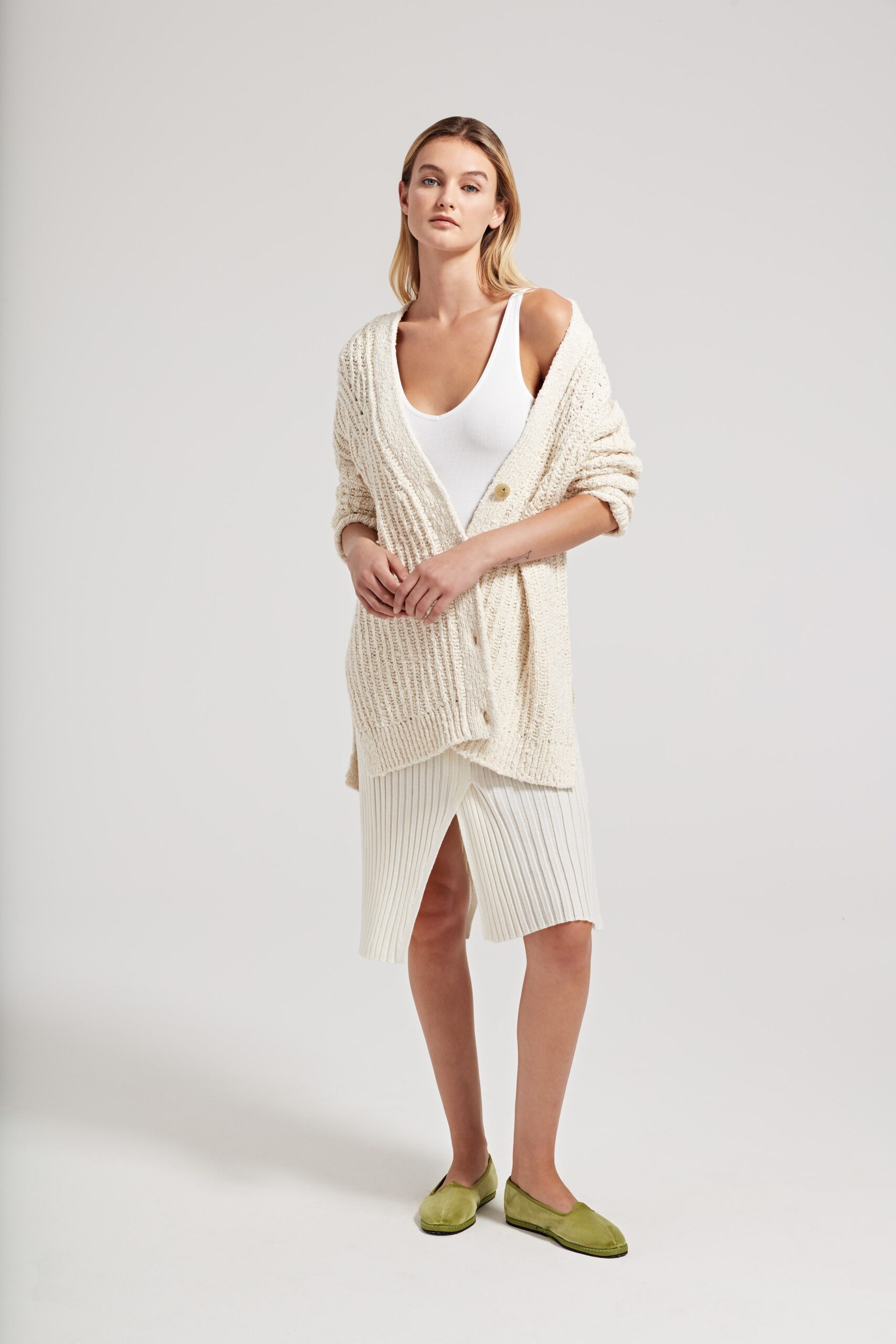 white cardigan with tank-top and skirt