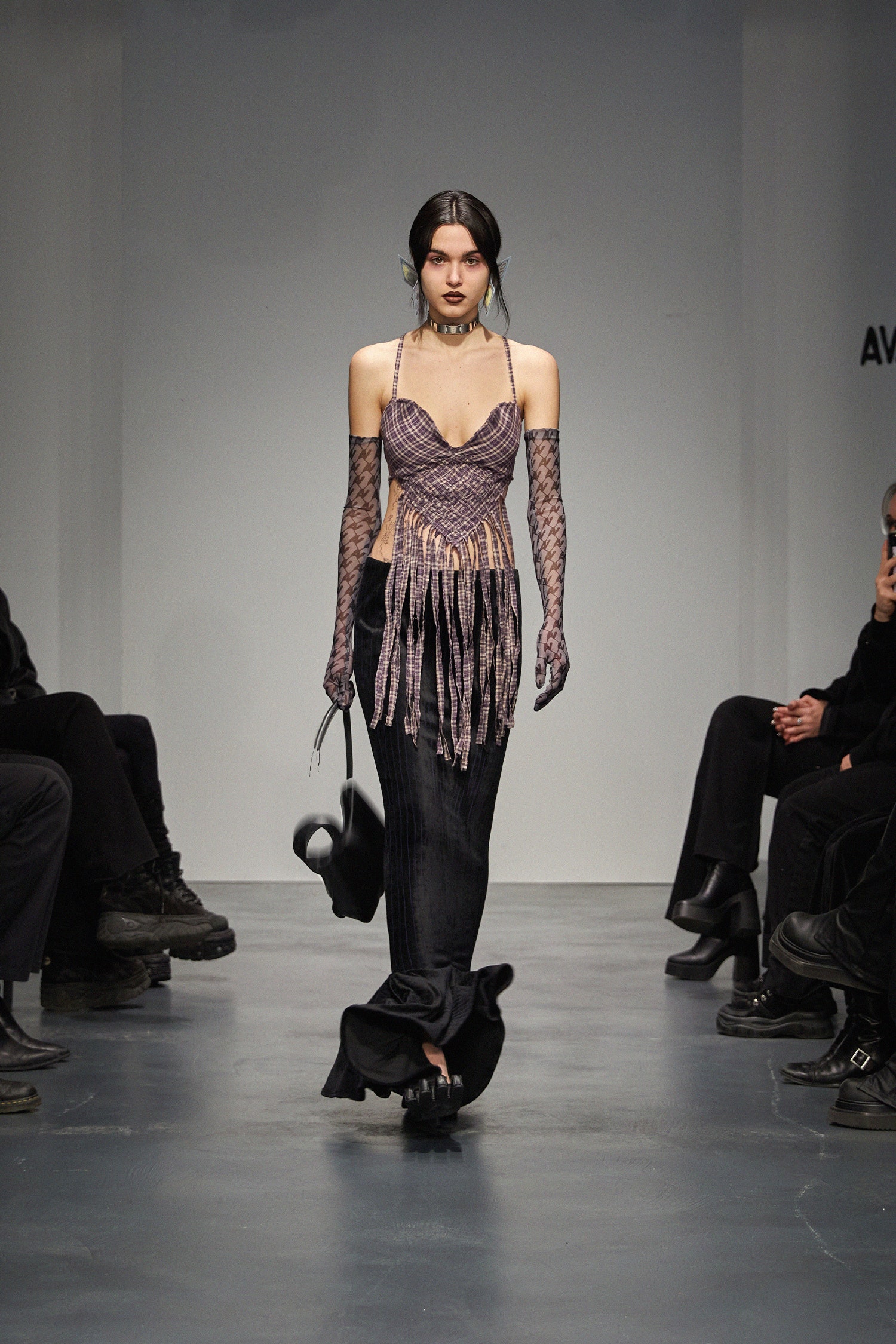purple fringed top with black skirt
