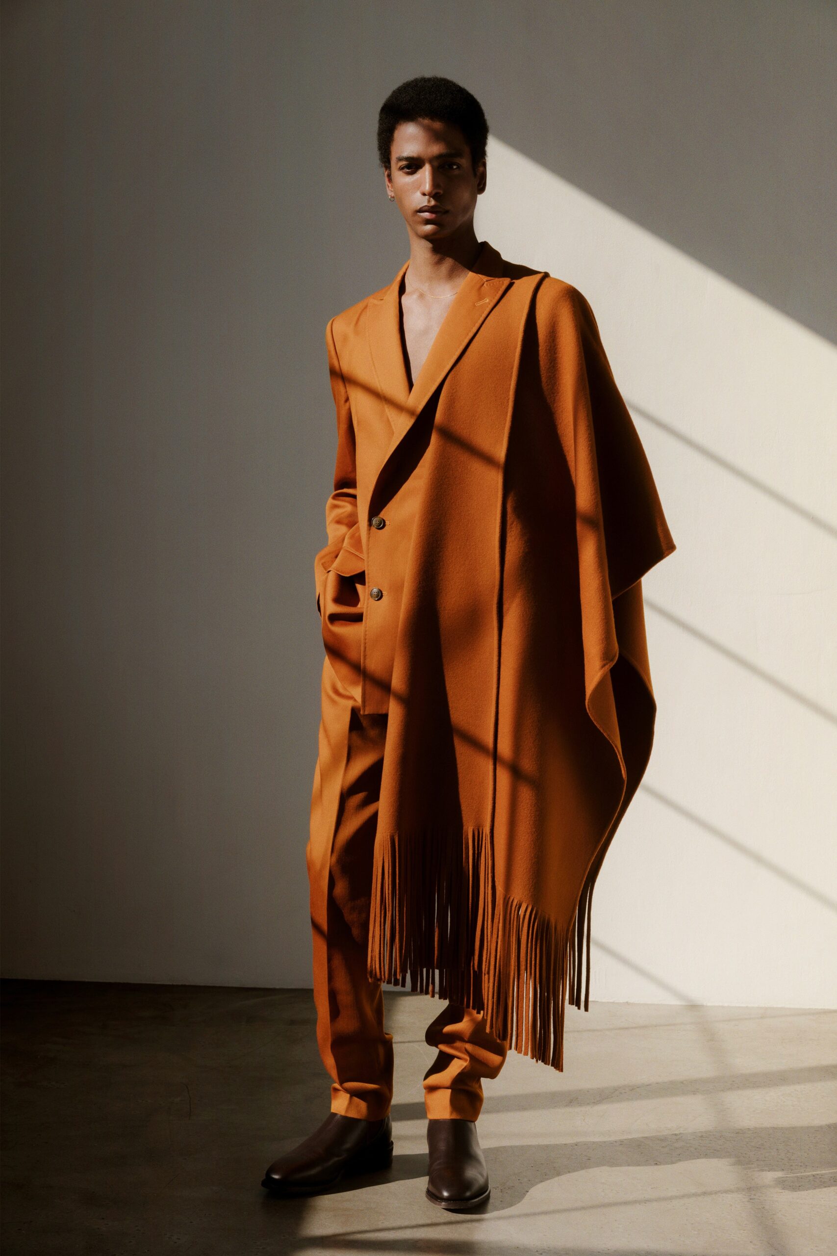 orange wool cape and suit