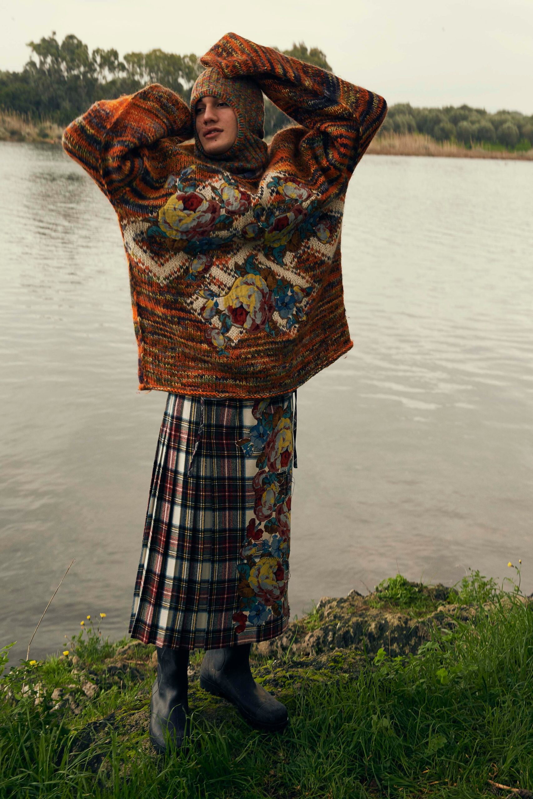 oversized orange wool sweater and pleated skirt