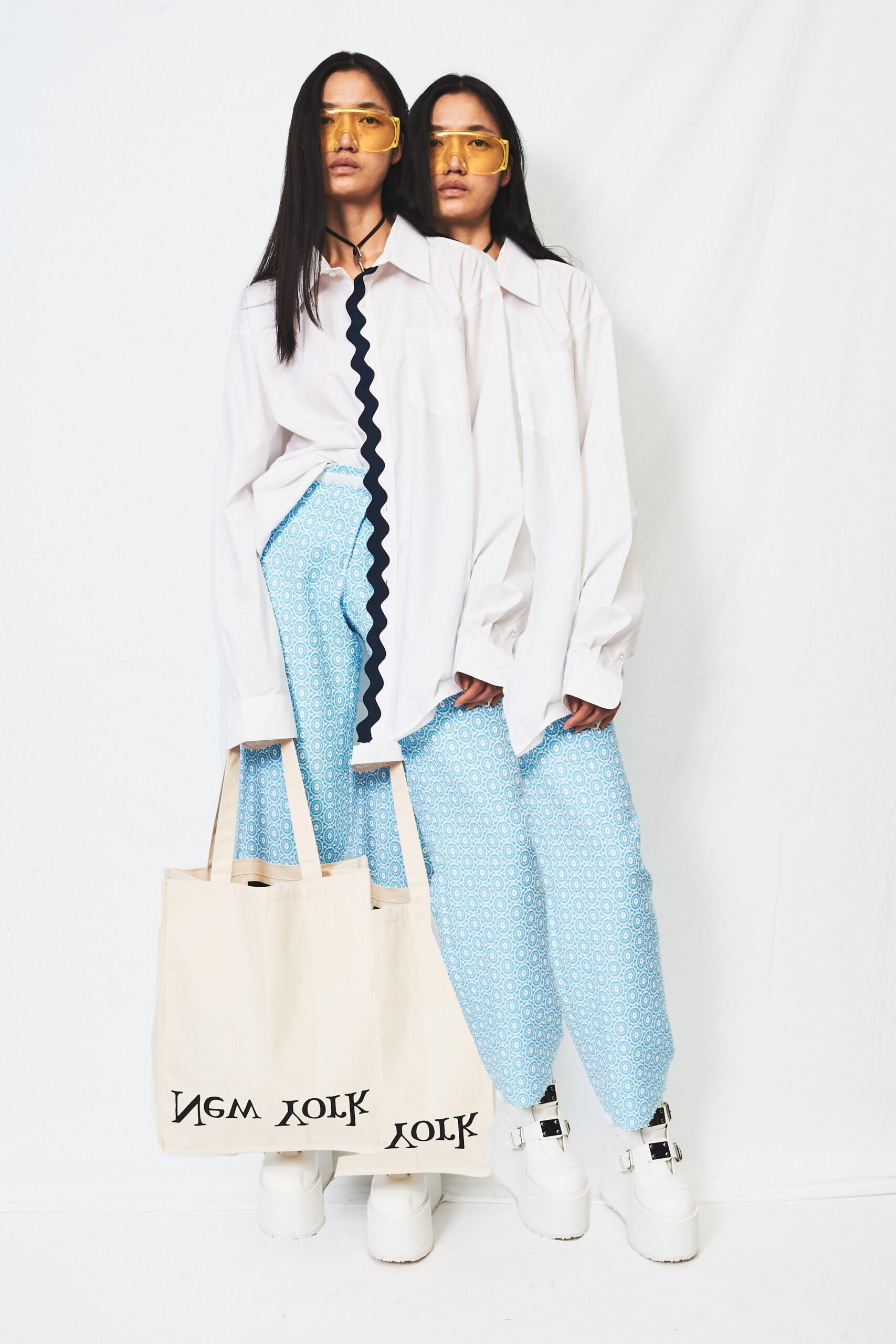 white relaxed shirt with blue pants