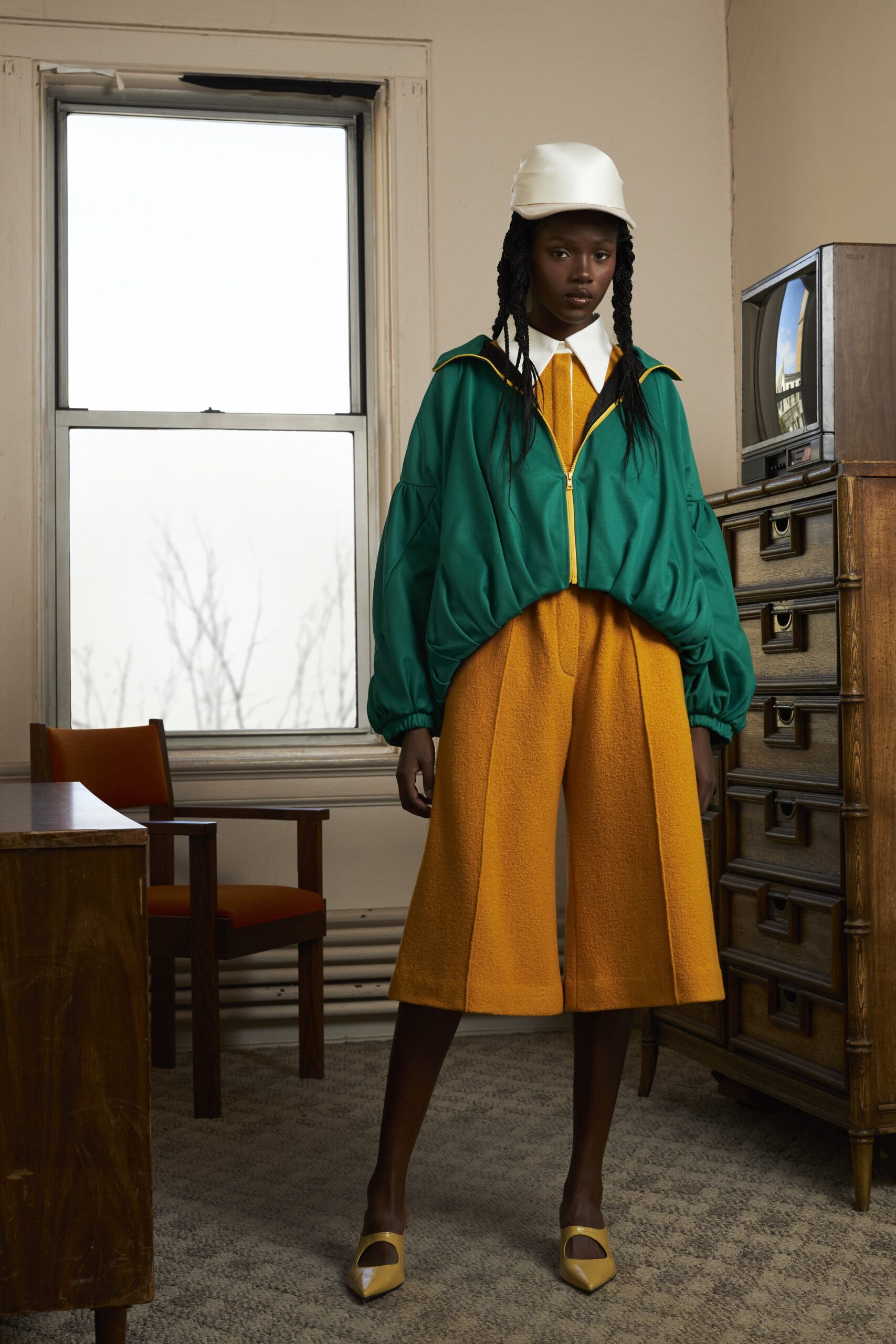 green oversized jacket with orange pants