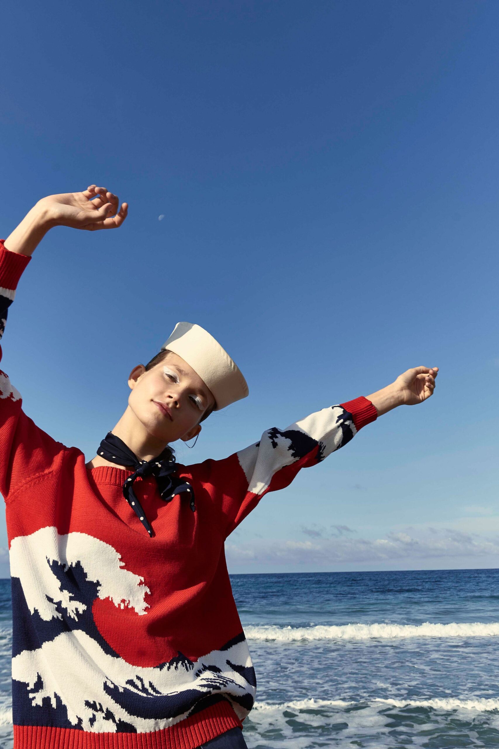 red printed sweater with scarf and hat