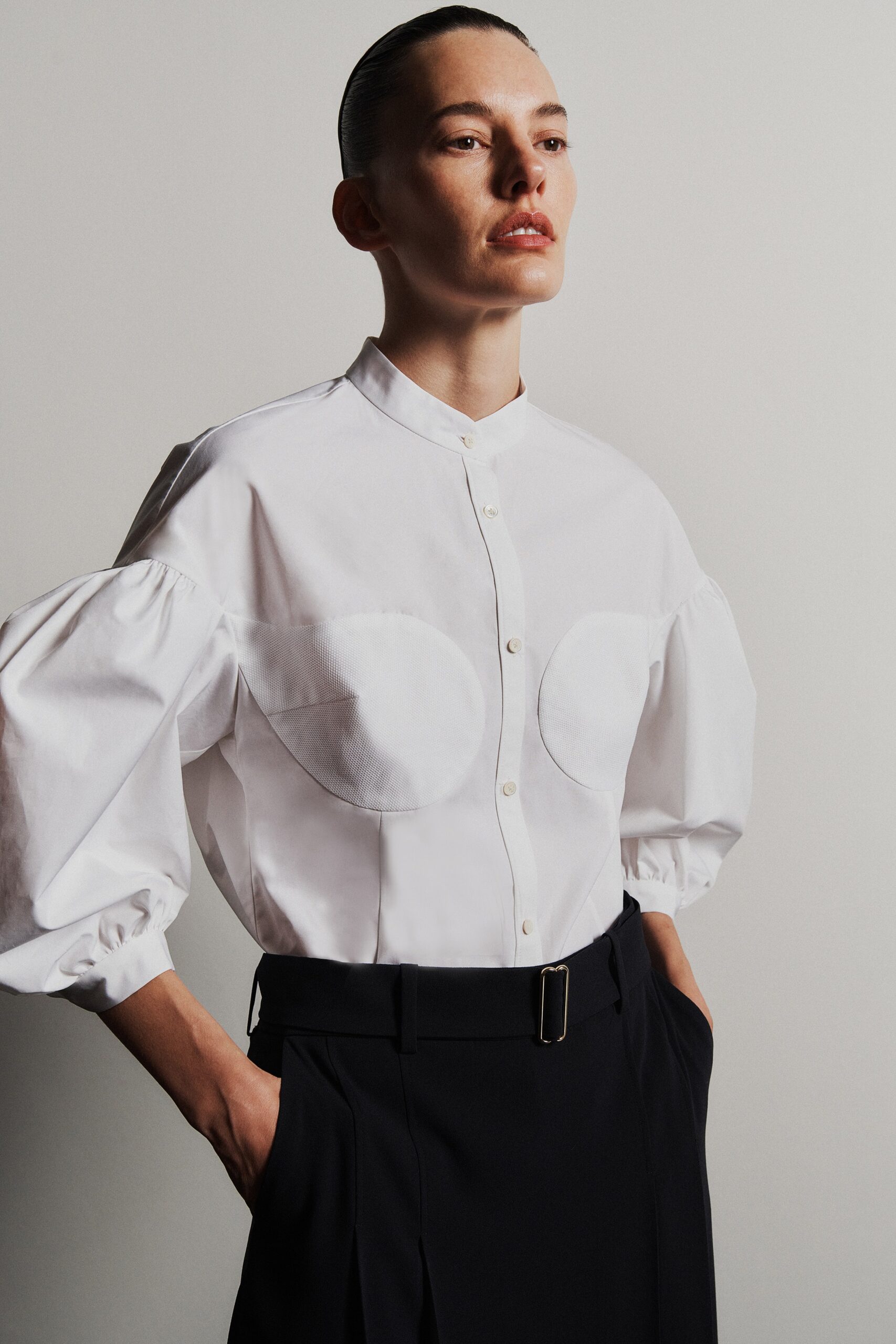 white fitted shirt with black tailored pants