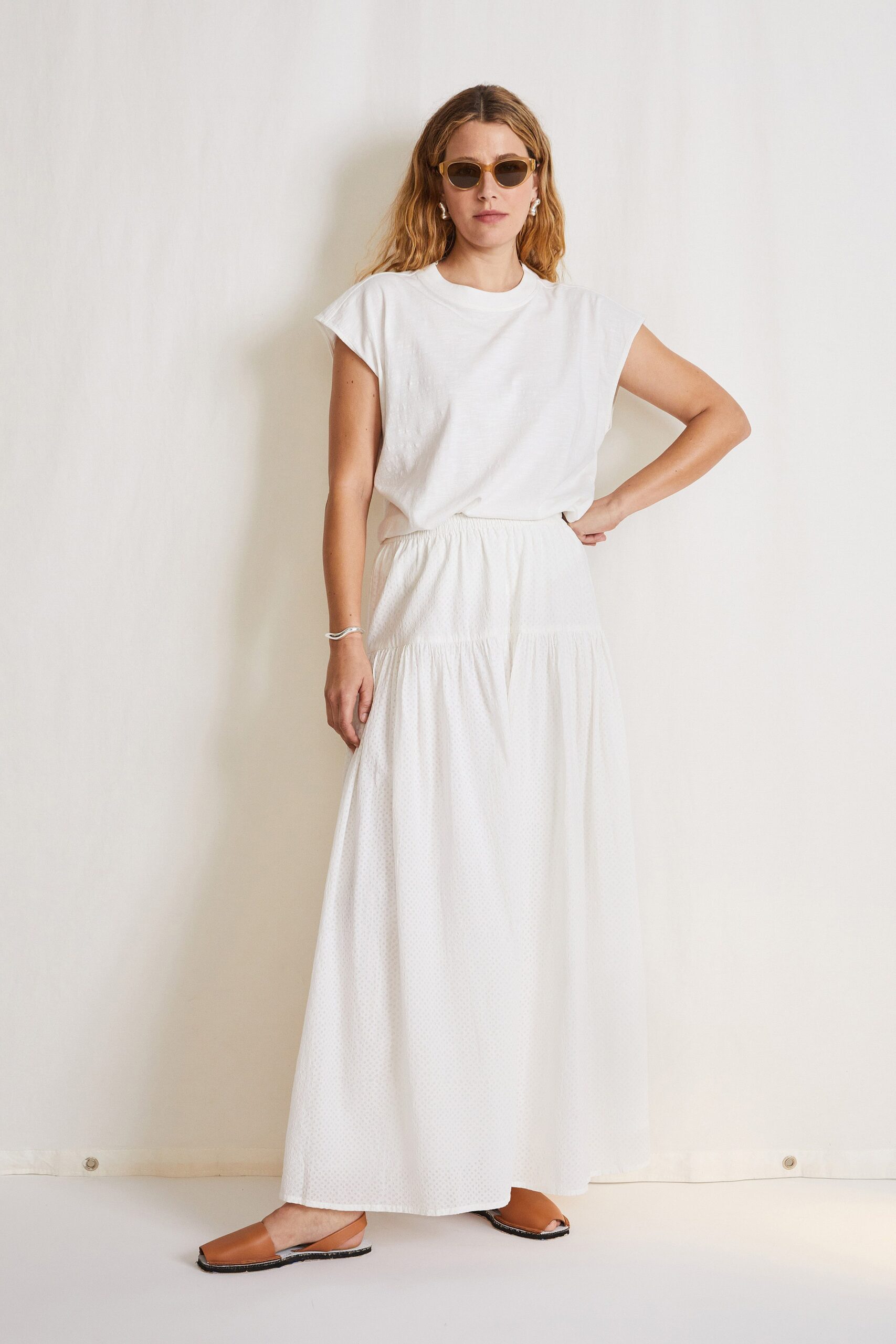 white relaxed top and tiered maxi skirt