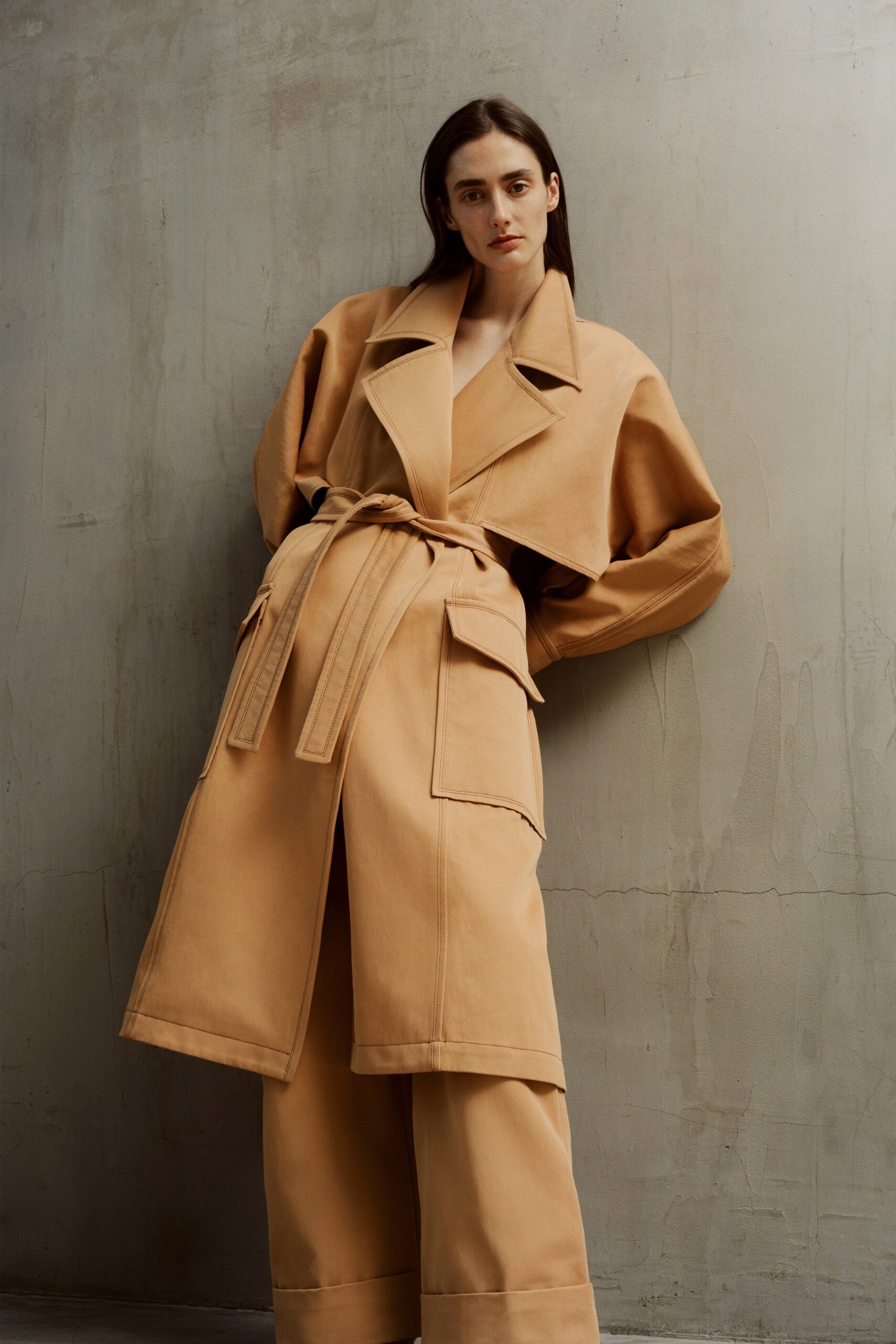 beige oversized coat and relaxed pants
