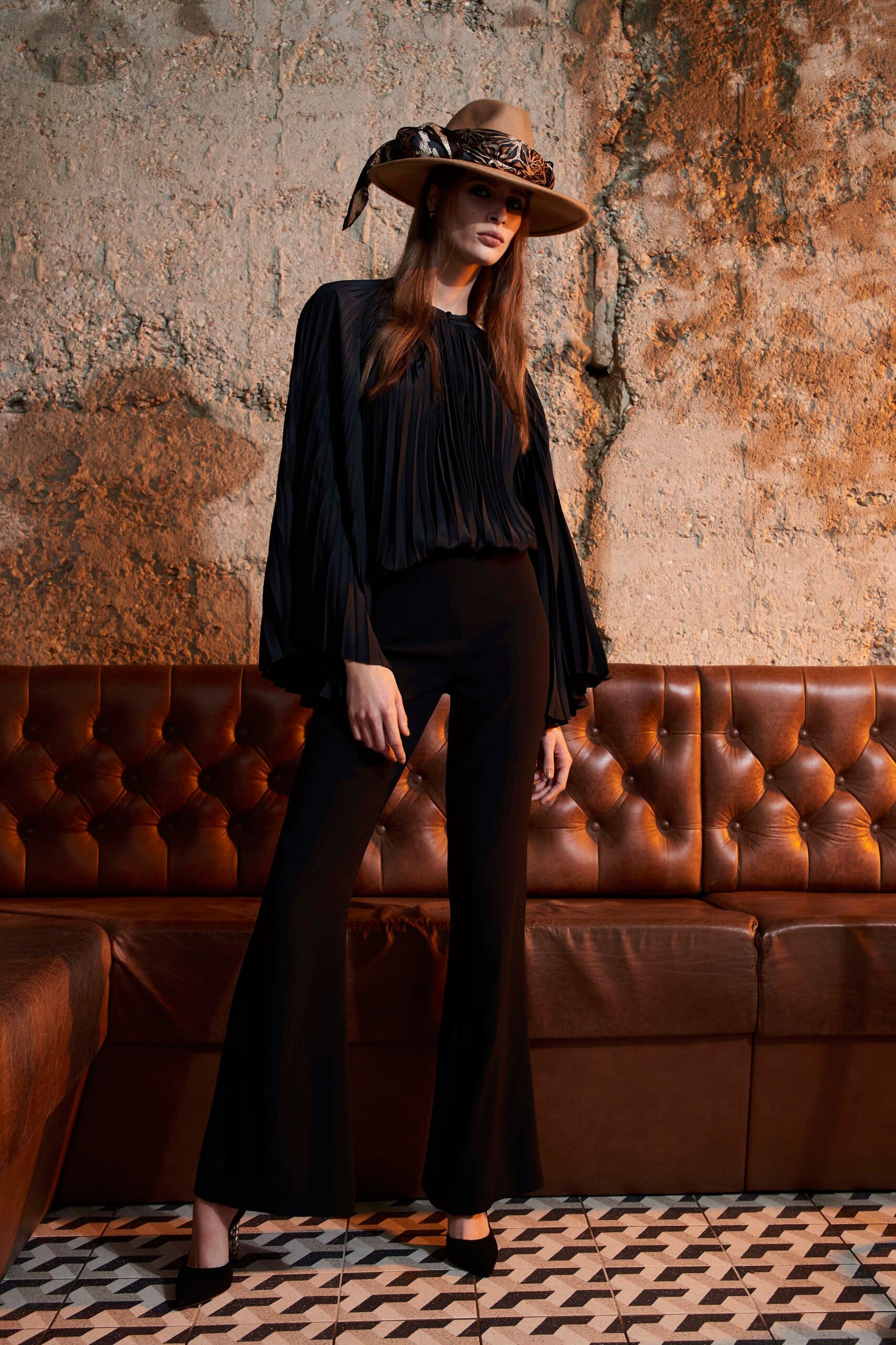 black pleated blouse with flared pants