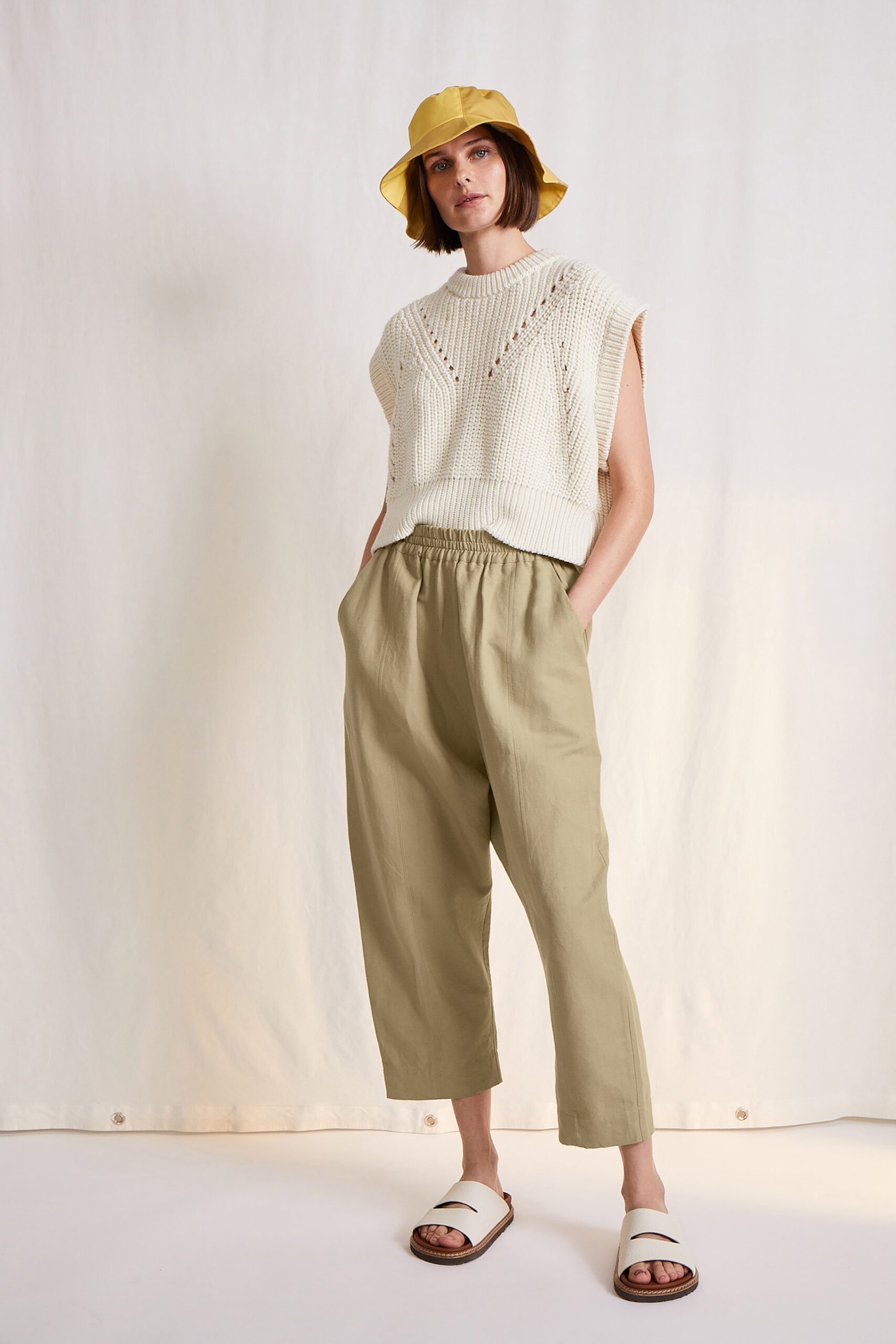 white knit top with beige pants