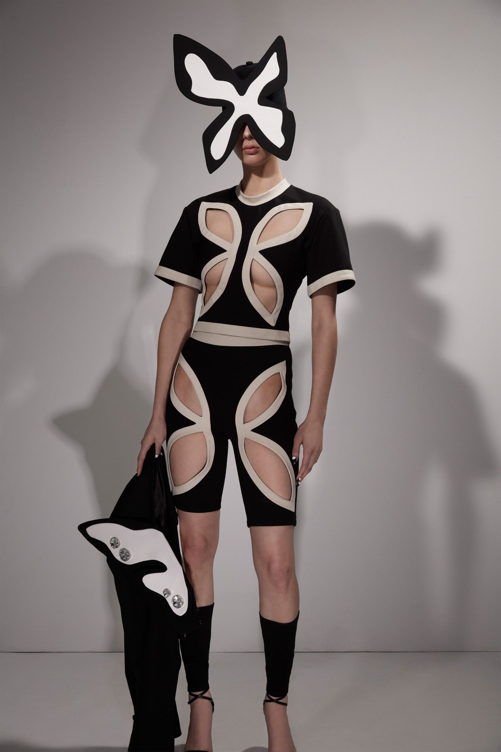 black and beige fitted top and shorts