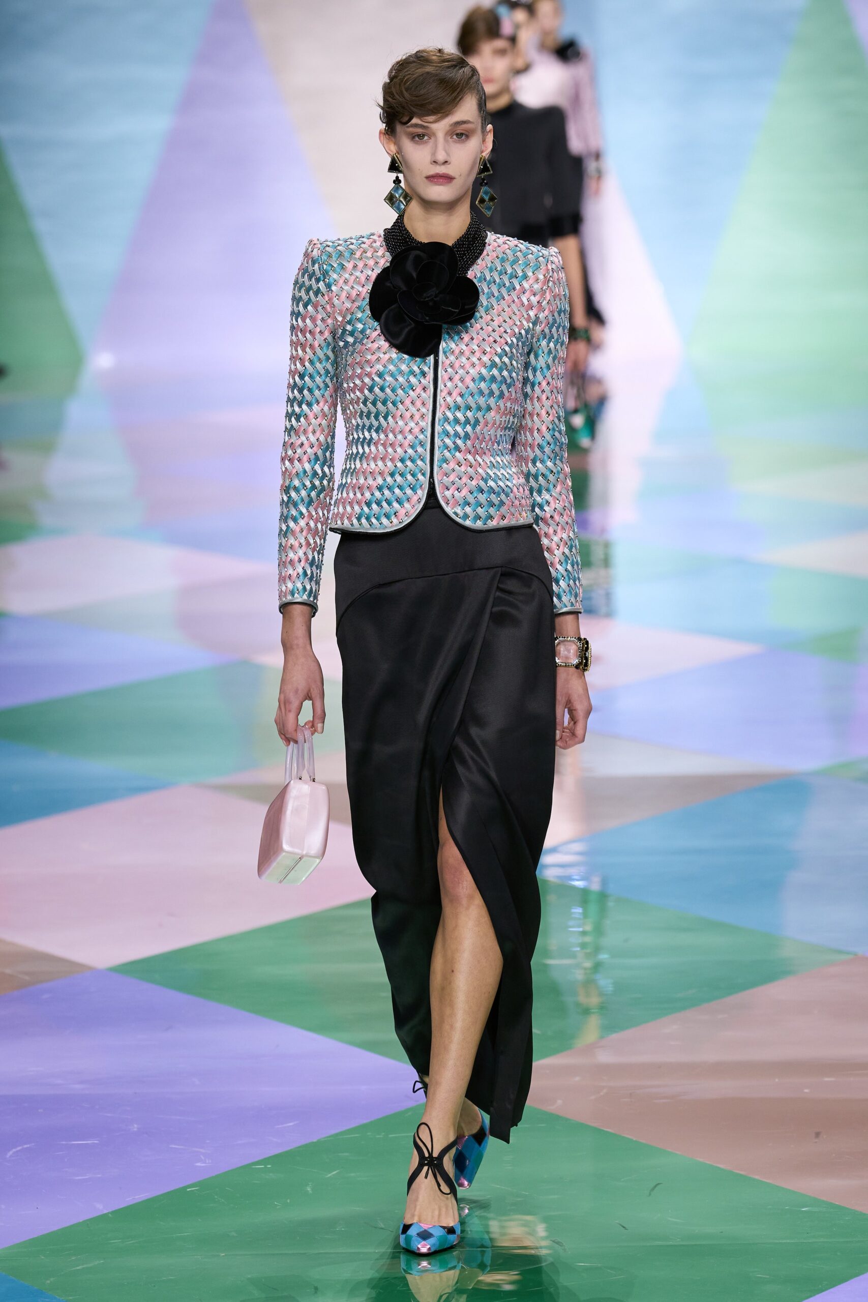 tailored pink silk blazer and black midi skirt