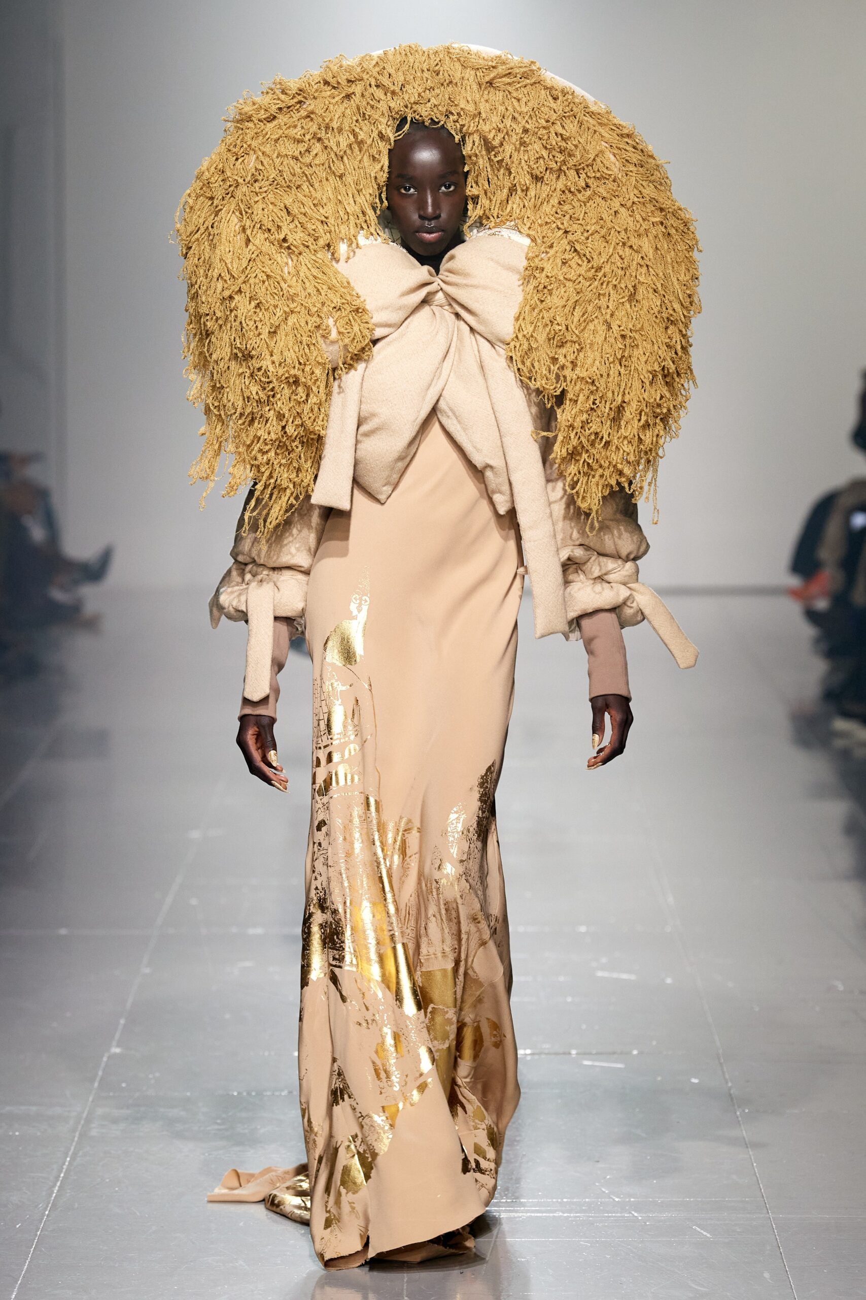 beige silk gown with oversized cape