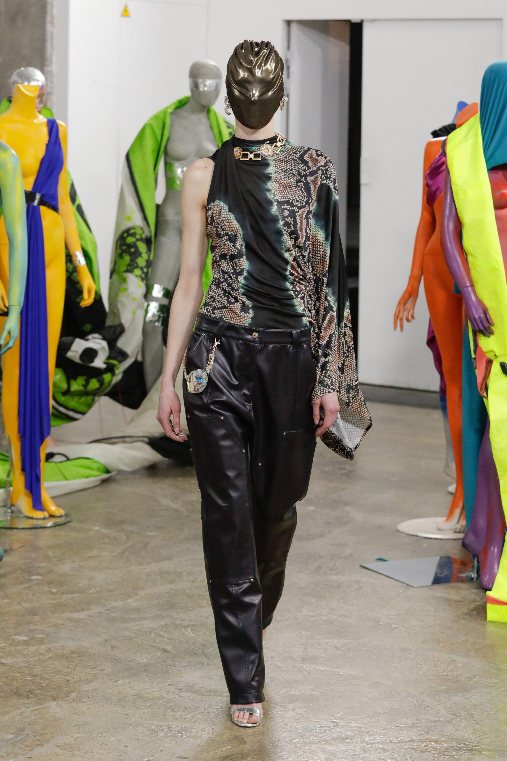 black fitted asymmetric top and relaxed pants