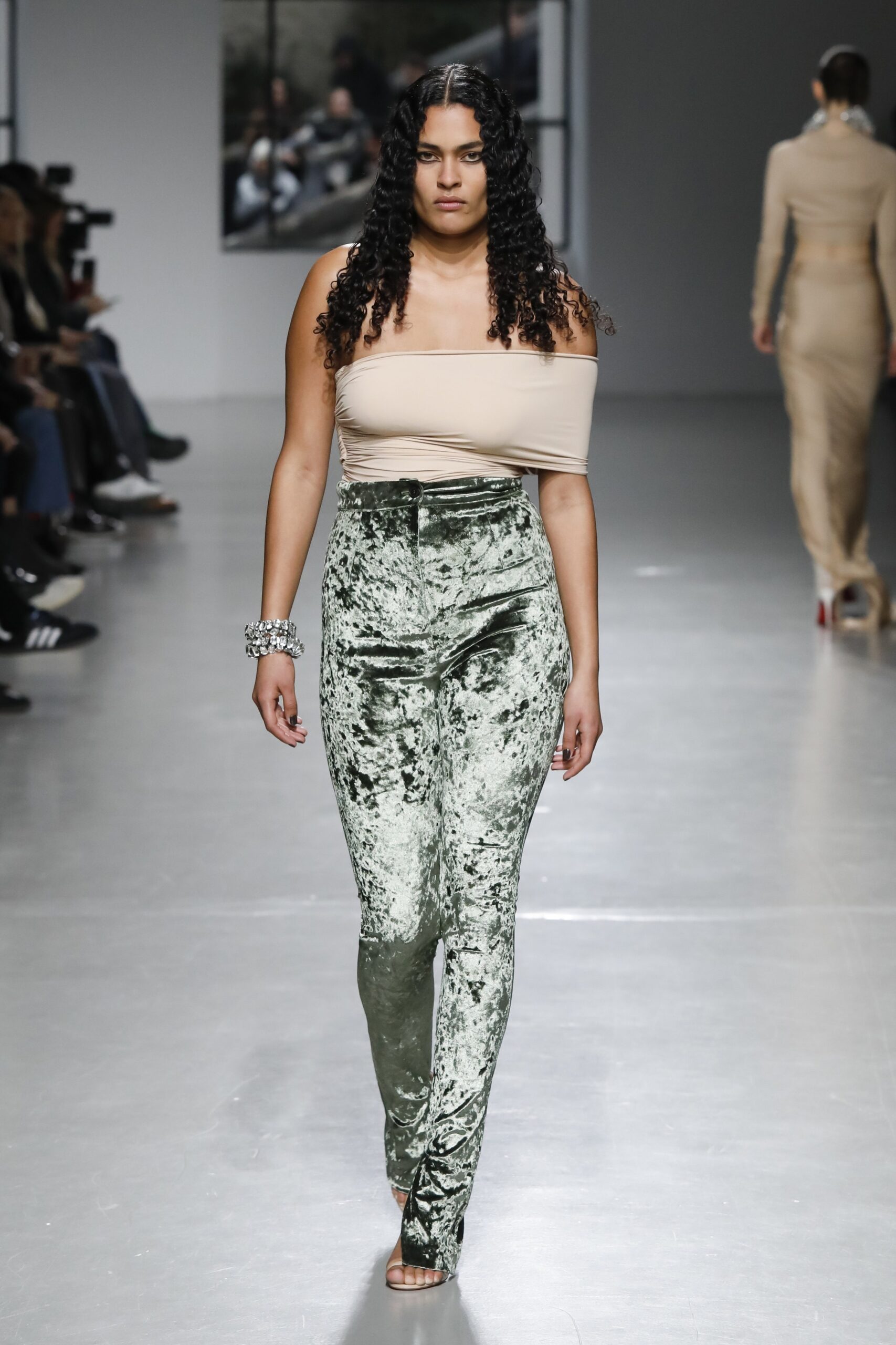 beige off-shoulder top and green velvet pants