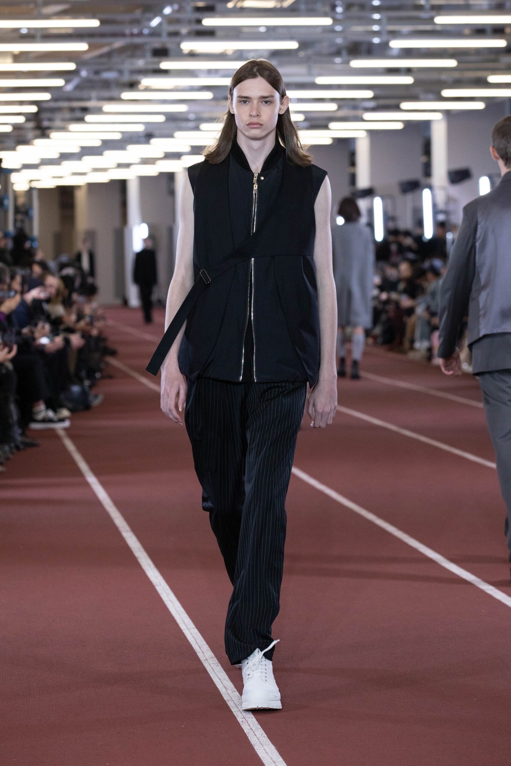 black fitted vest and relaxed pants