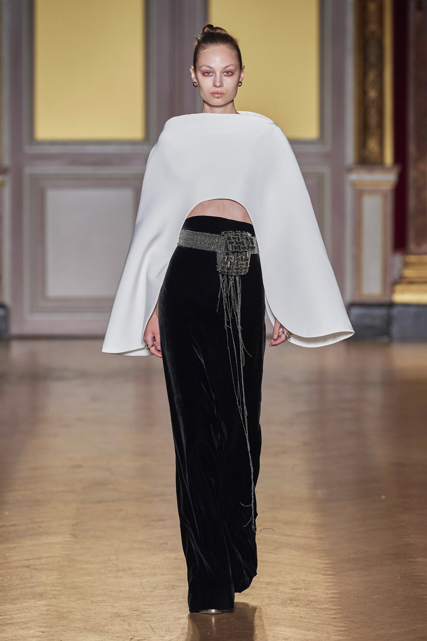 white silk cape and black velvet pants