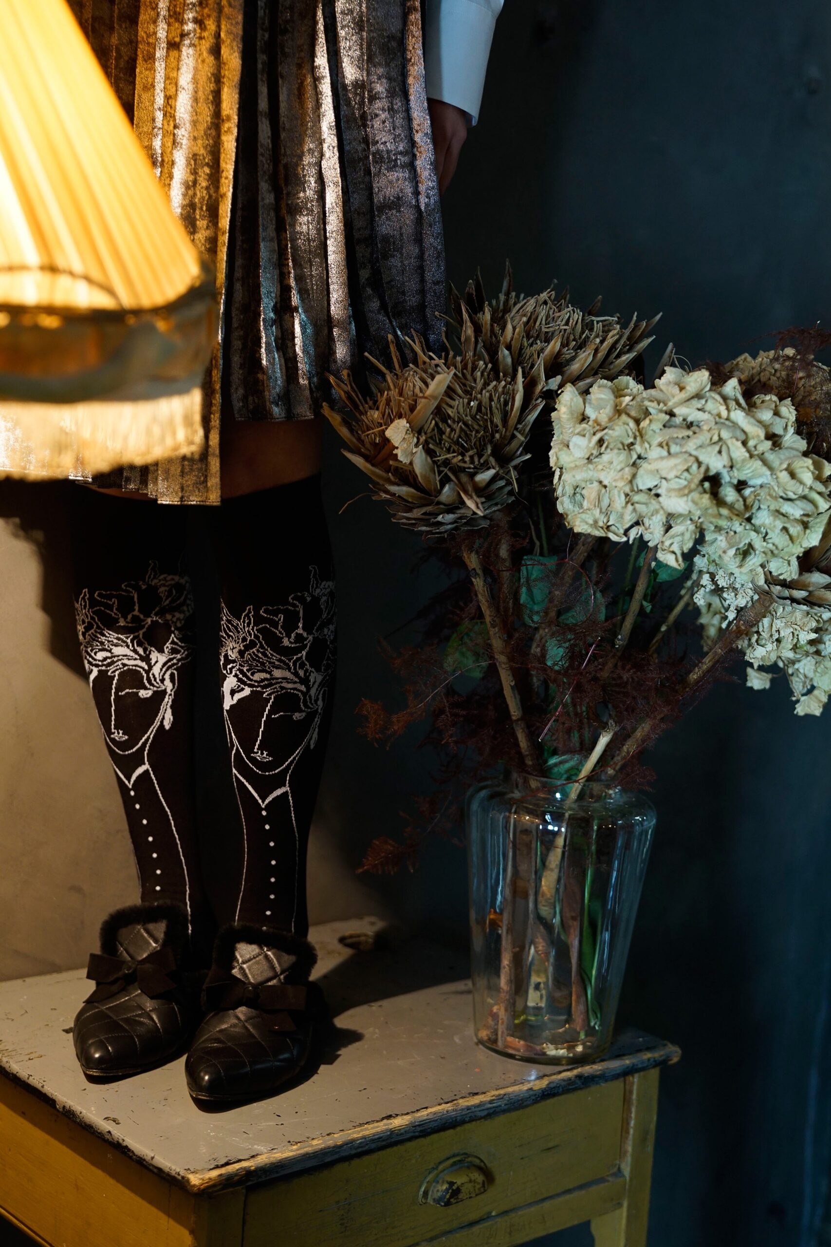 gold pleated midi skirt with black socks