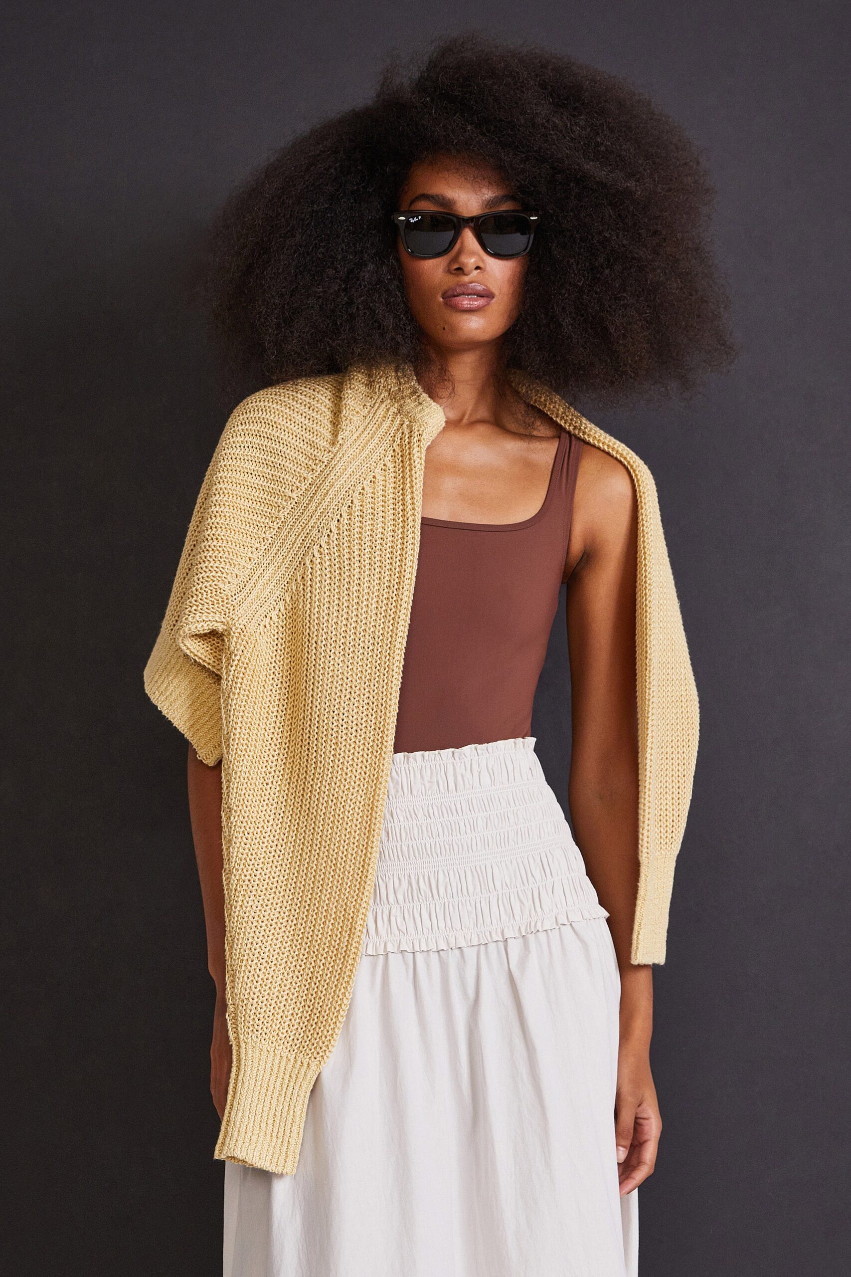 brown fitted top beige cardigan white pleated skirt