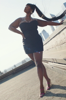black silk sleeveless v-neck fitted ruched shiny mini-dress