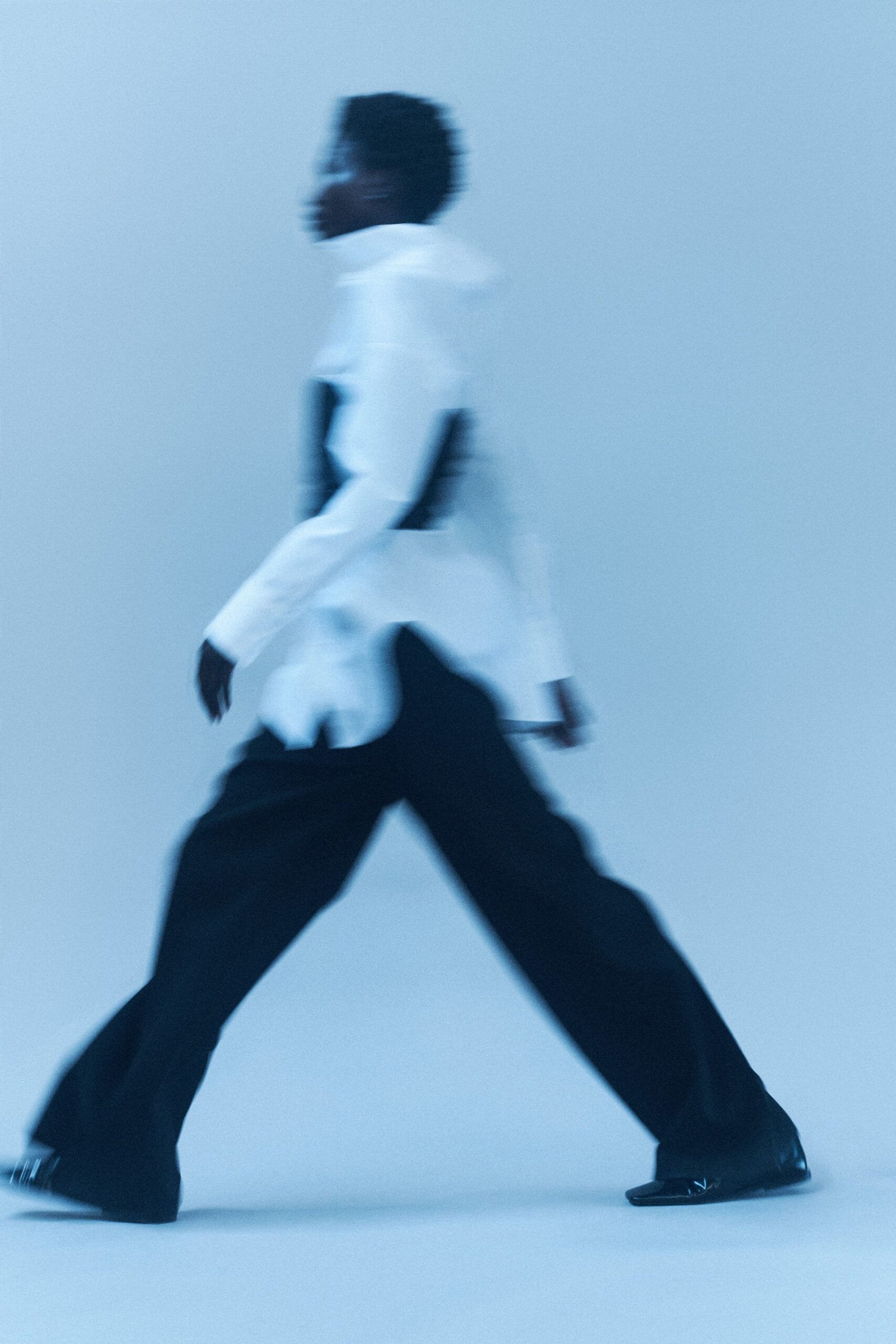white relaxed shirt and black pants