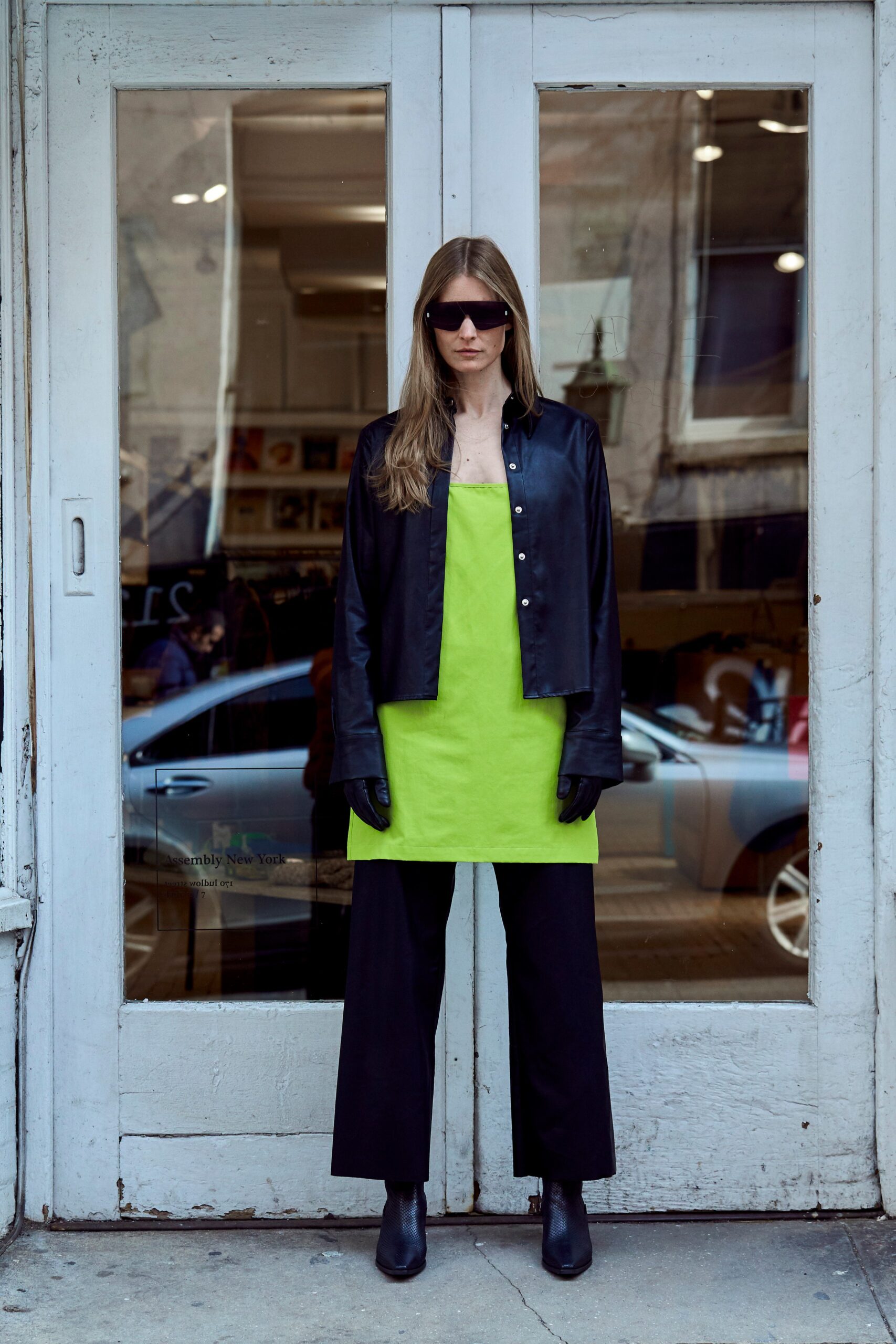 black leather jacket with green top