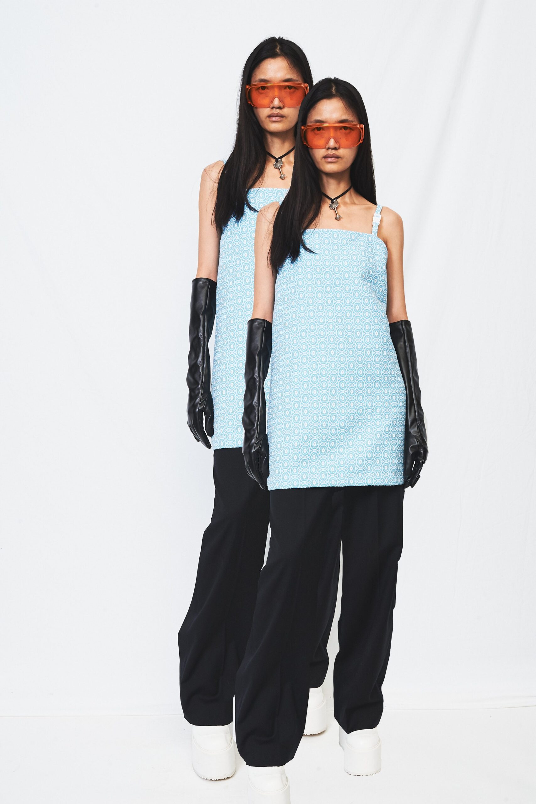 blue fitted top with black pants