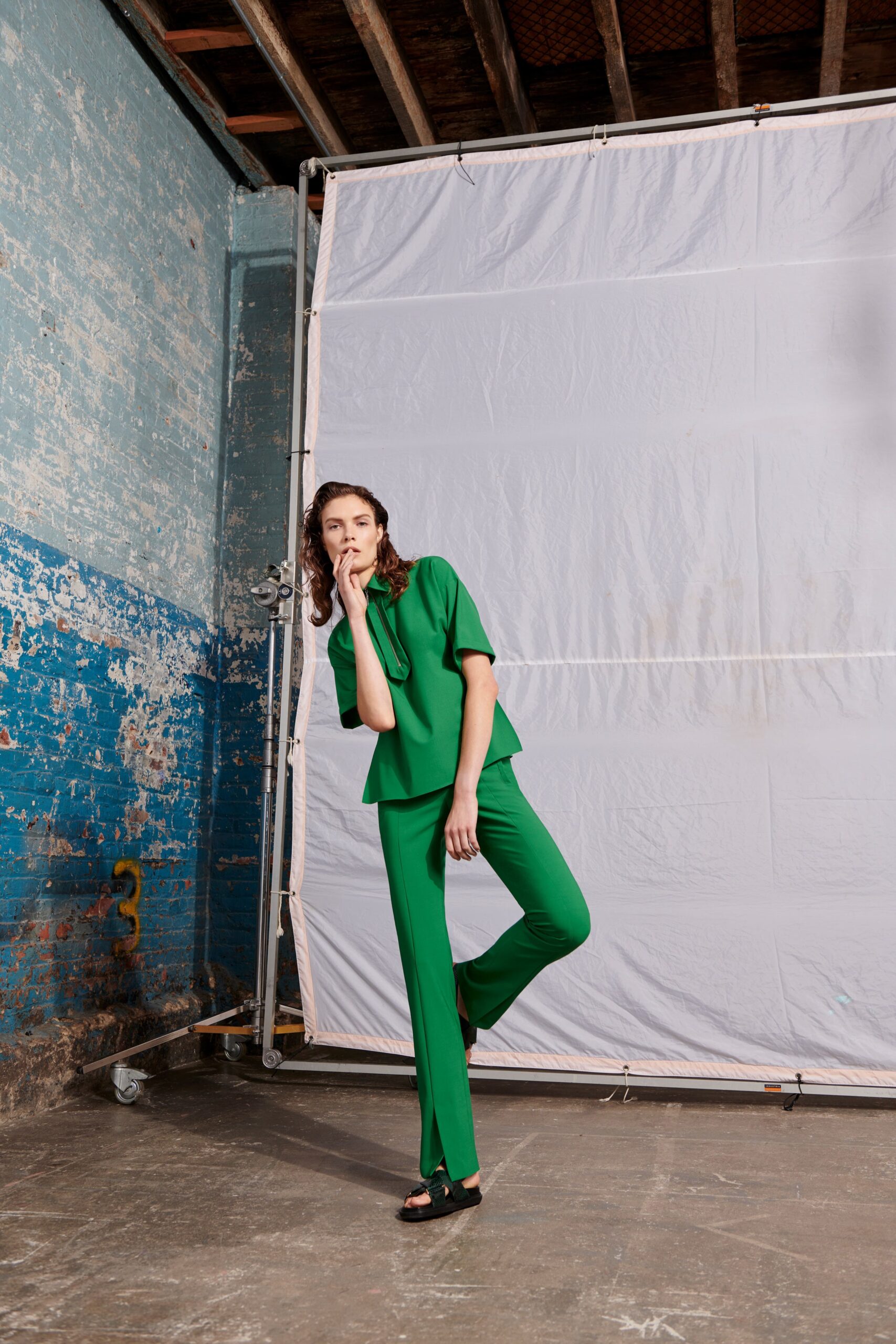 green short-sleeve high-neck relaxed top