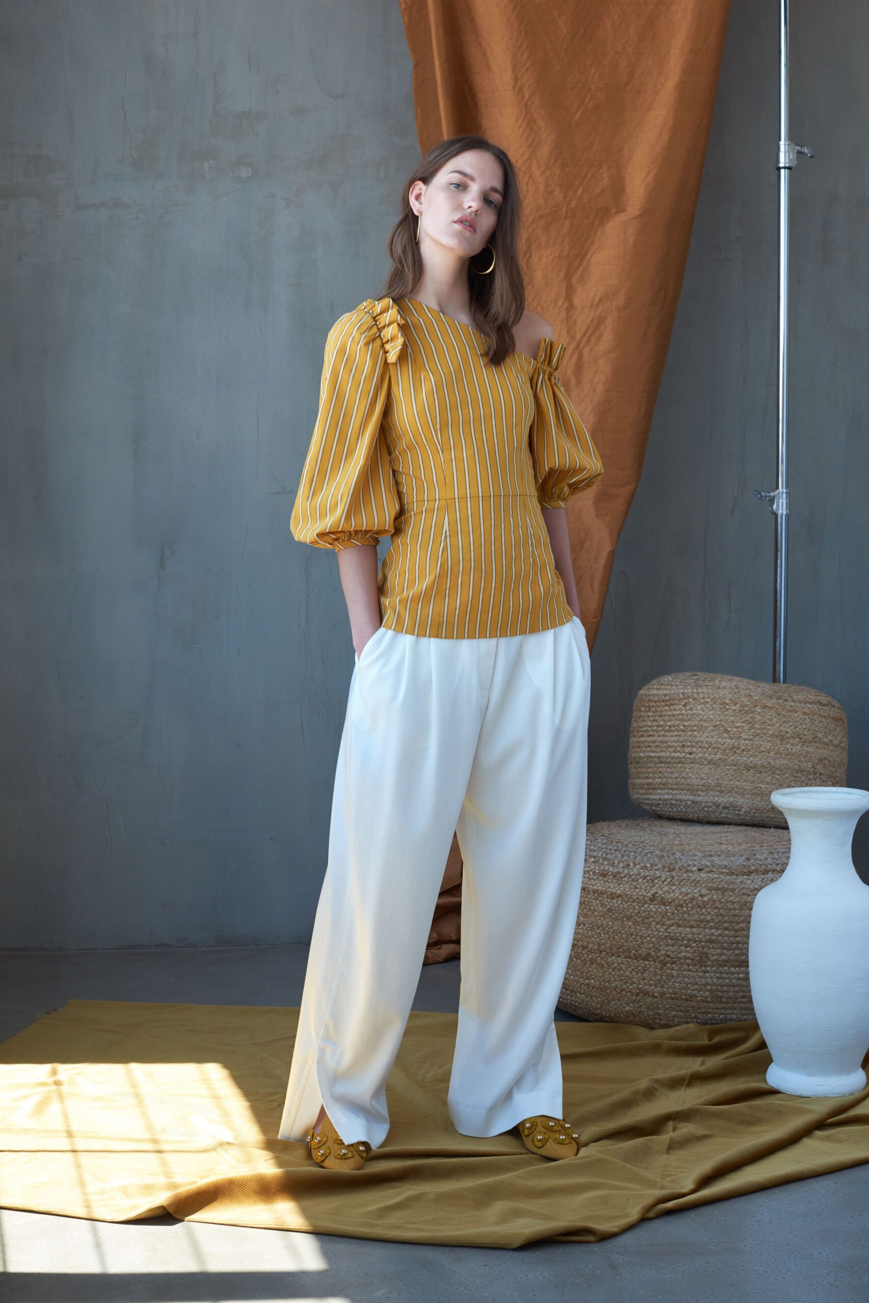 yellow striped relaxed top with white pants
