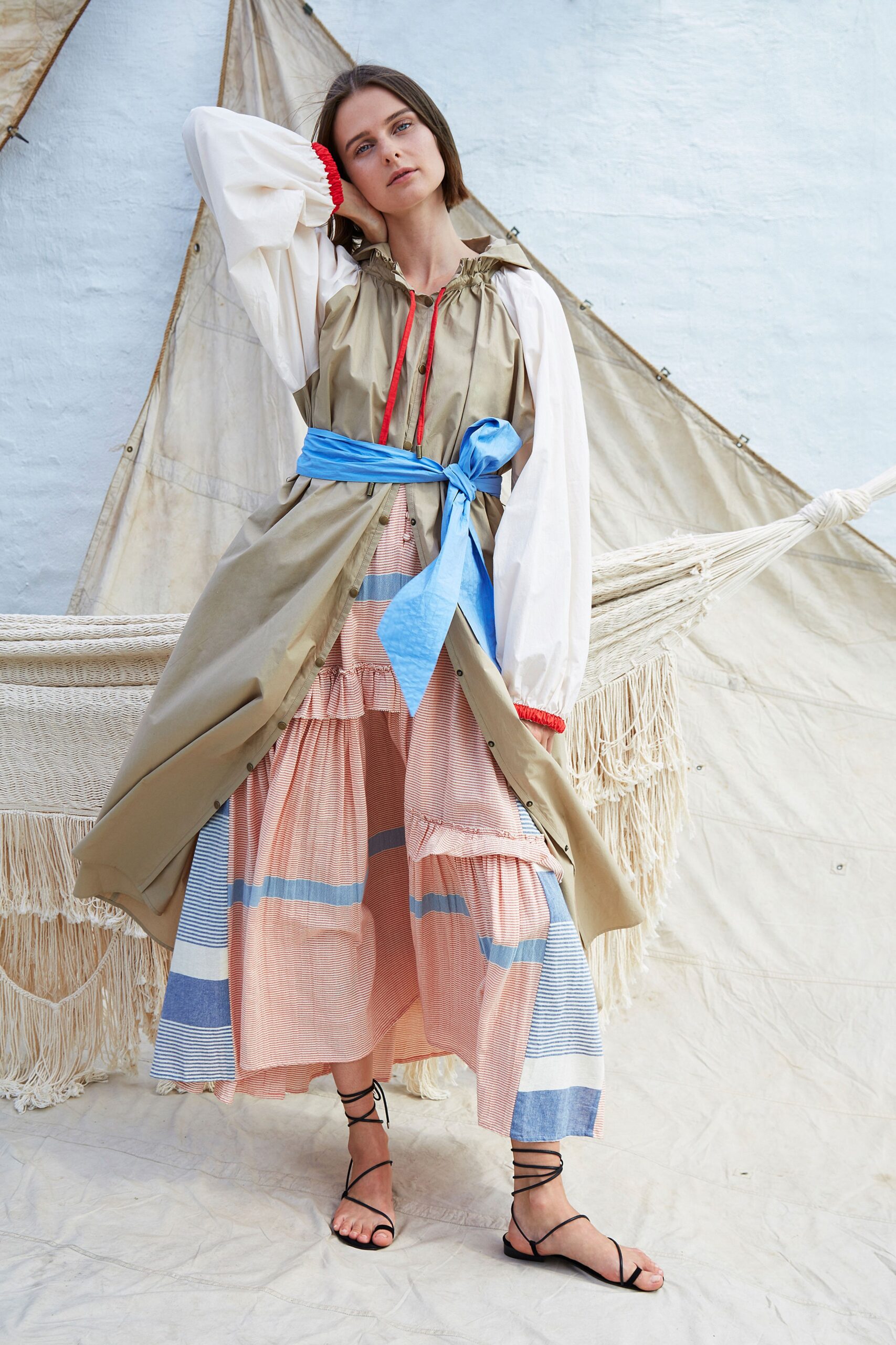 beige coat with multi-tiered dress