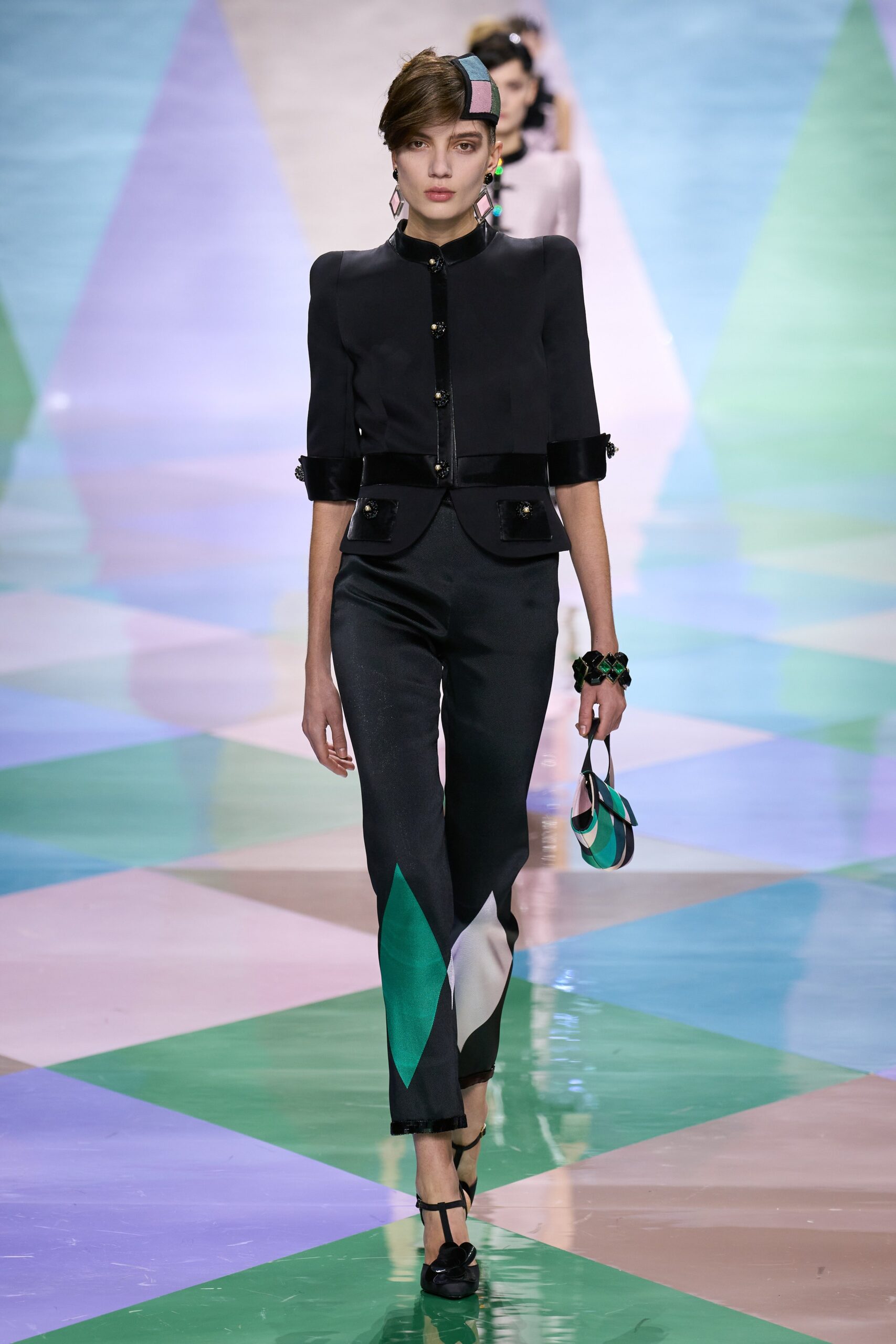 black structured jacket and color-blocked pants