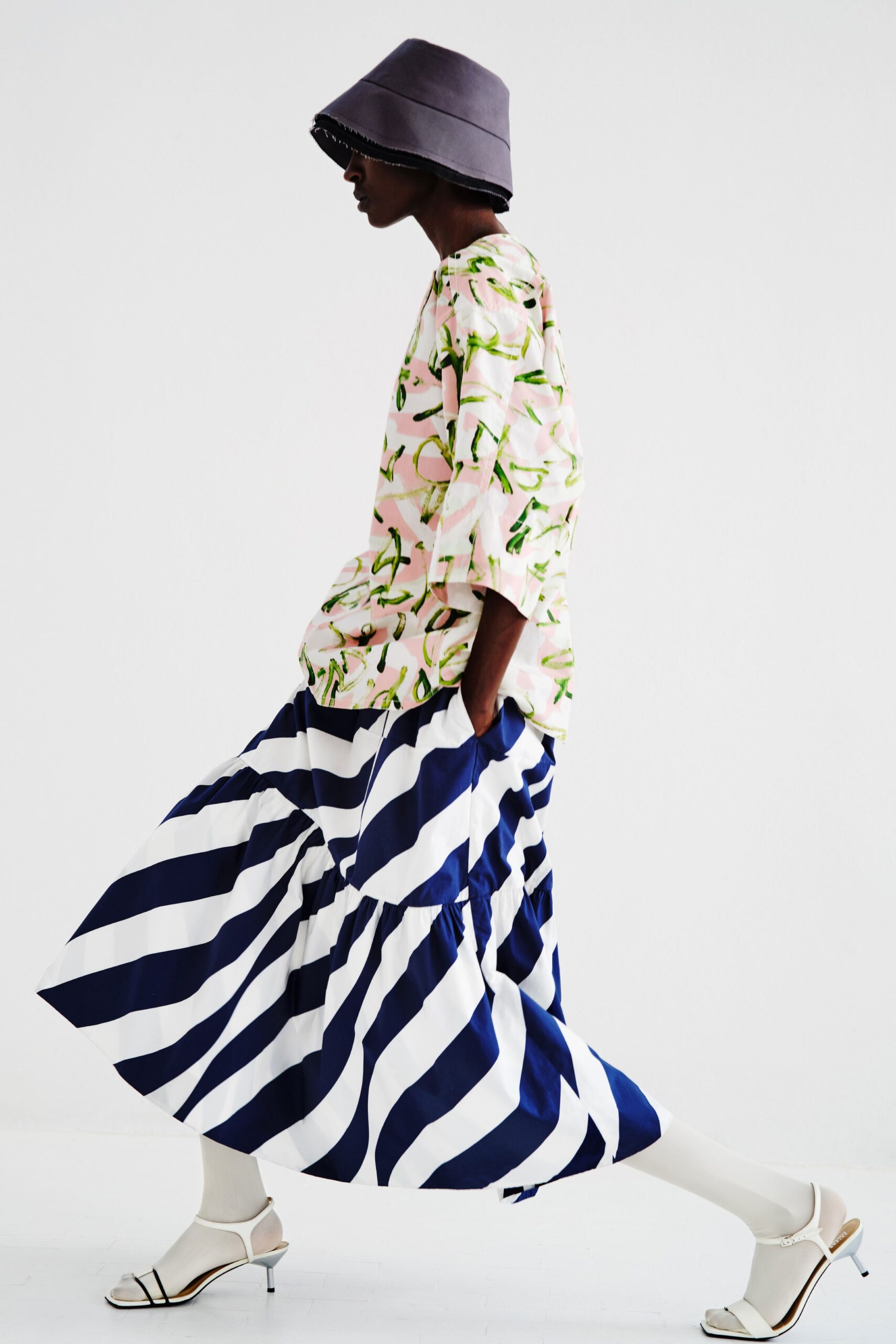 pink printed top with striped midi skirt