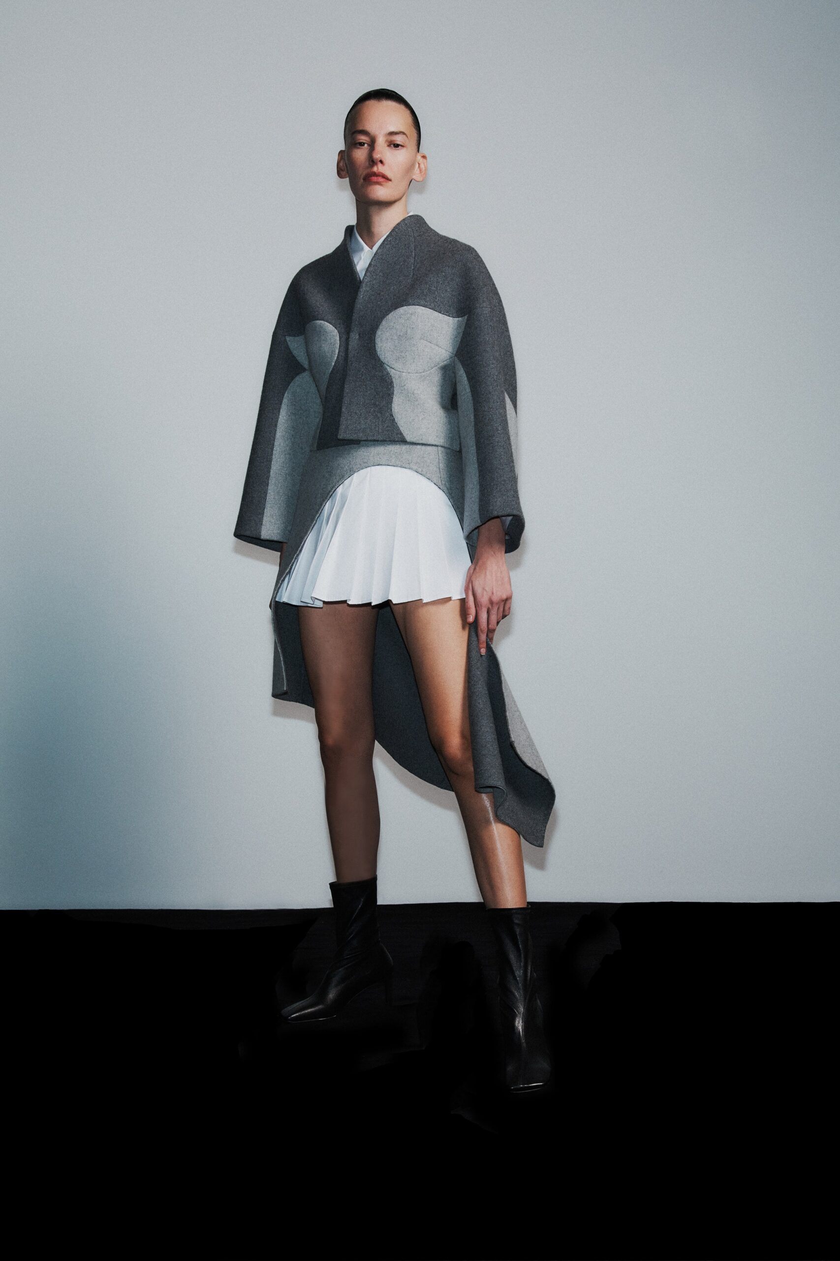 gray wool cape and white mini dress