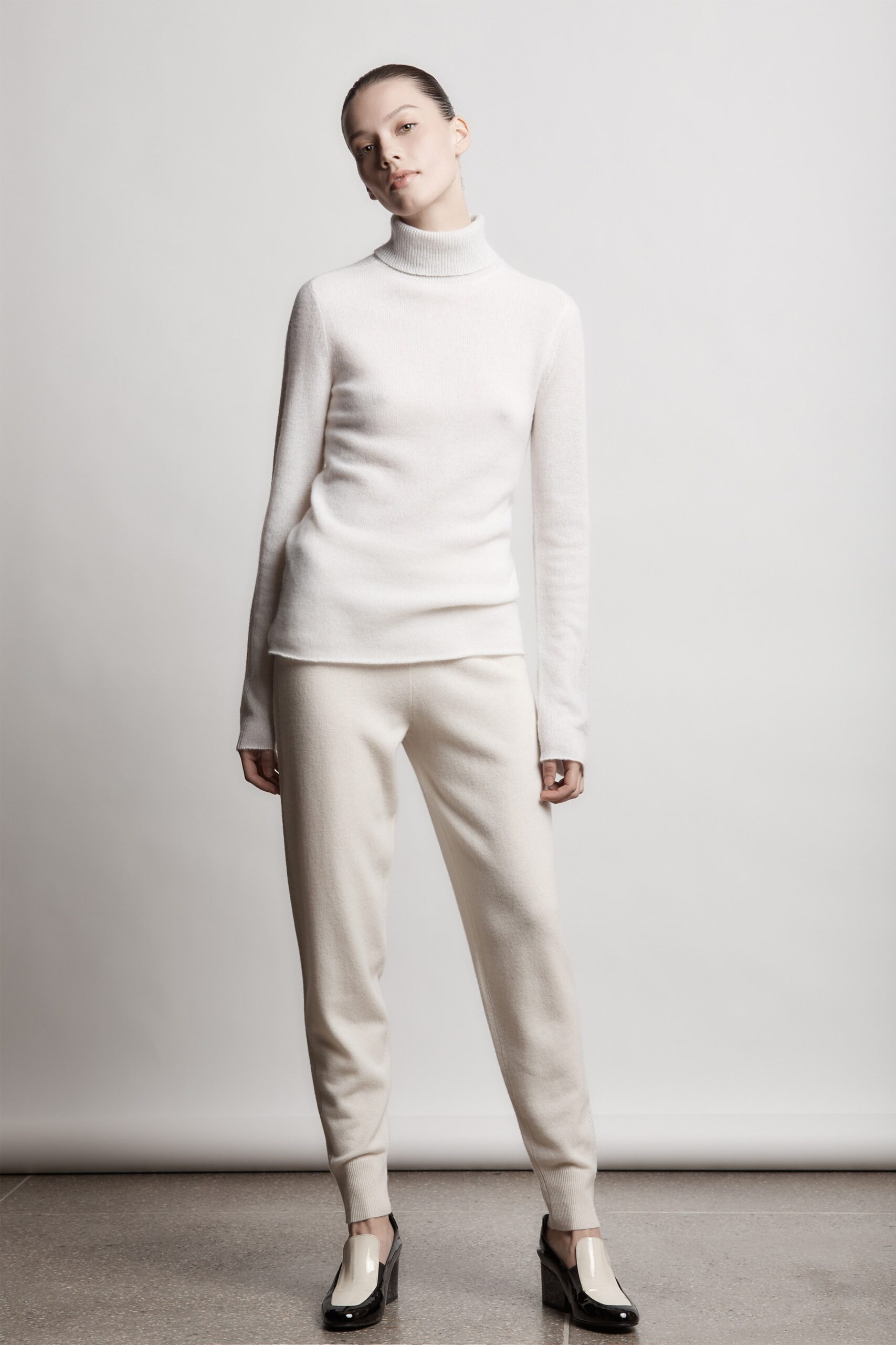 white fitted wool top and beige pants
