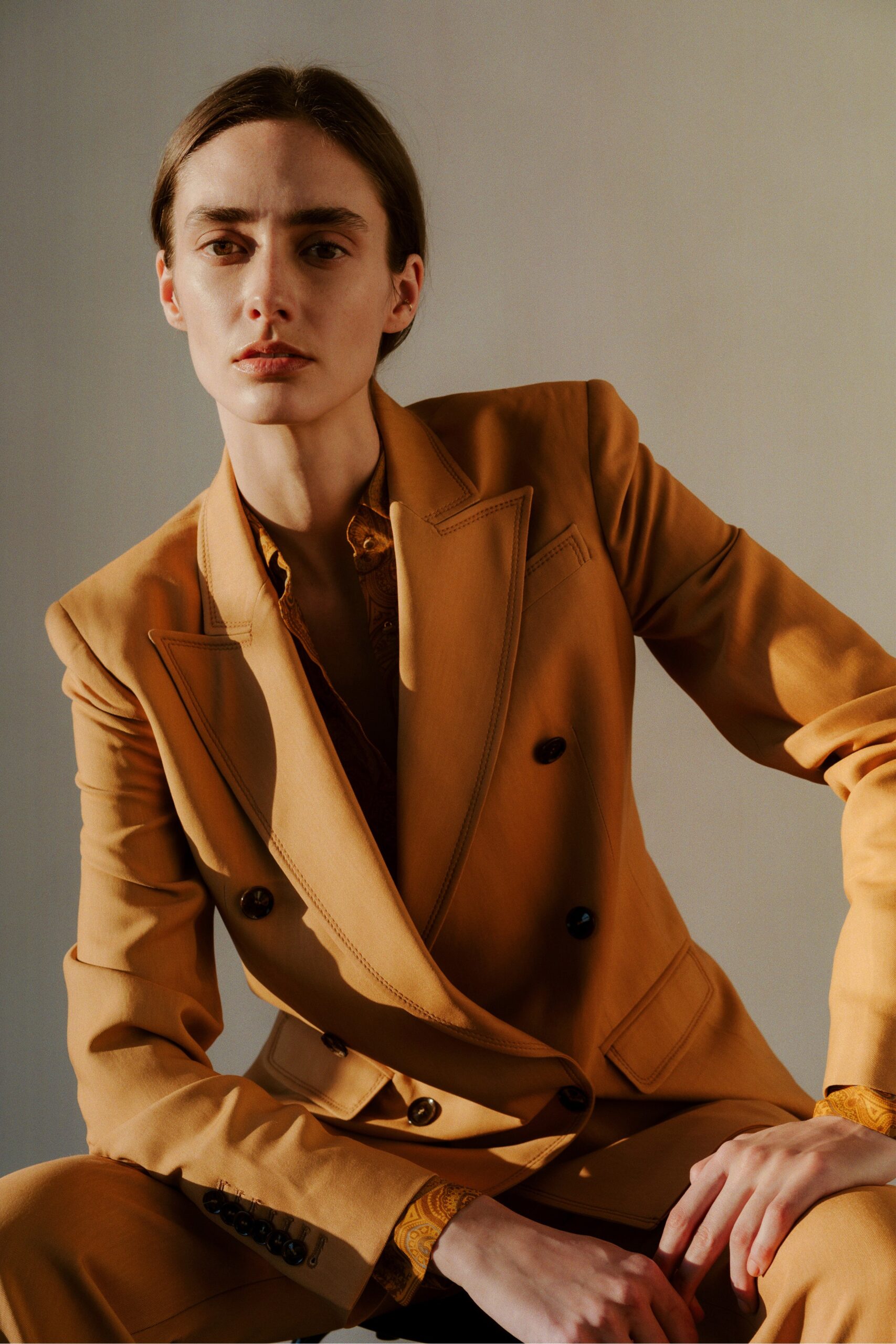 orange tailored suit with gold shirt