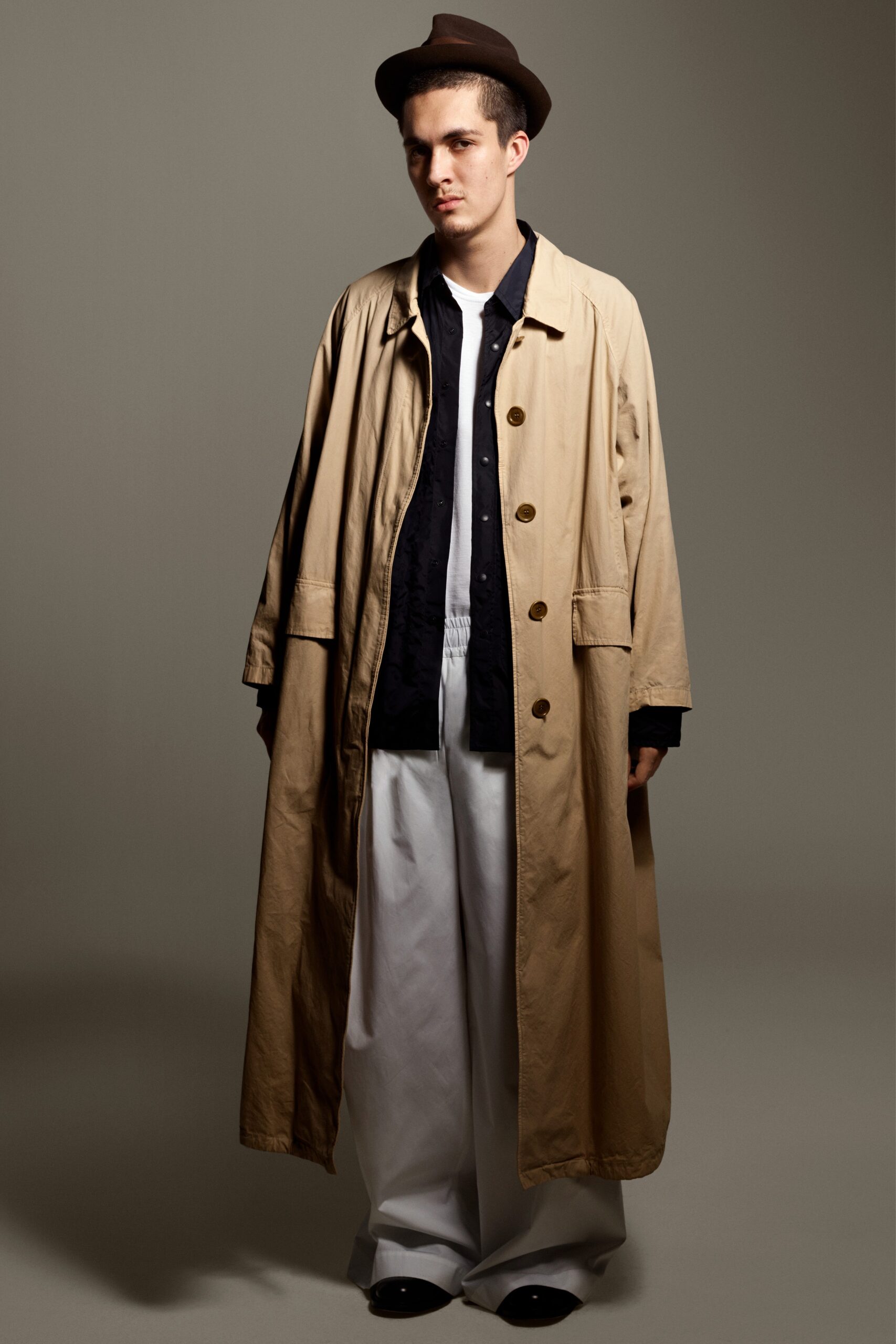 beige trench coat with black shirt