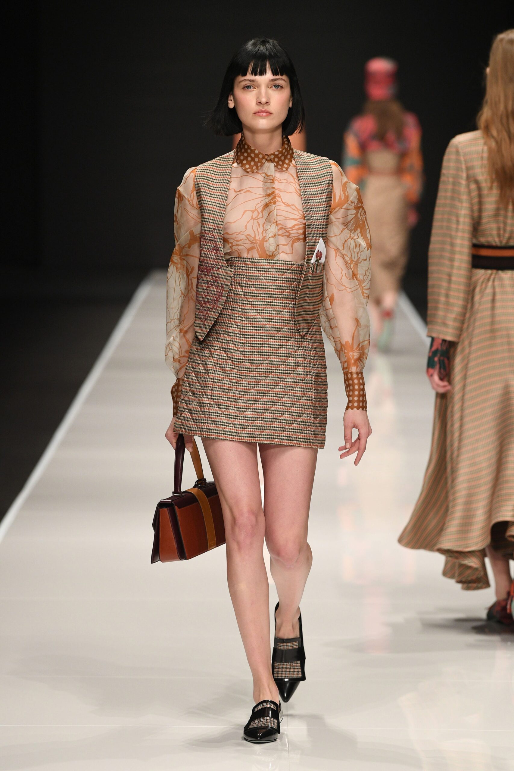 beige embroidered top with mini skirt