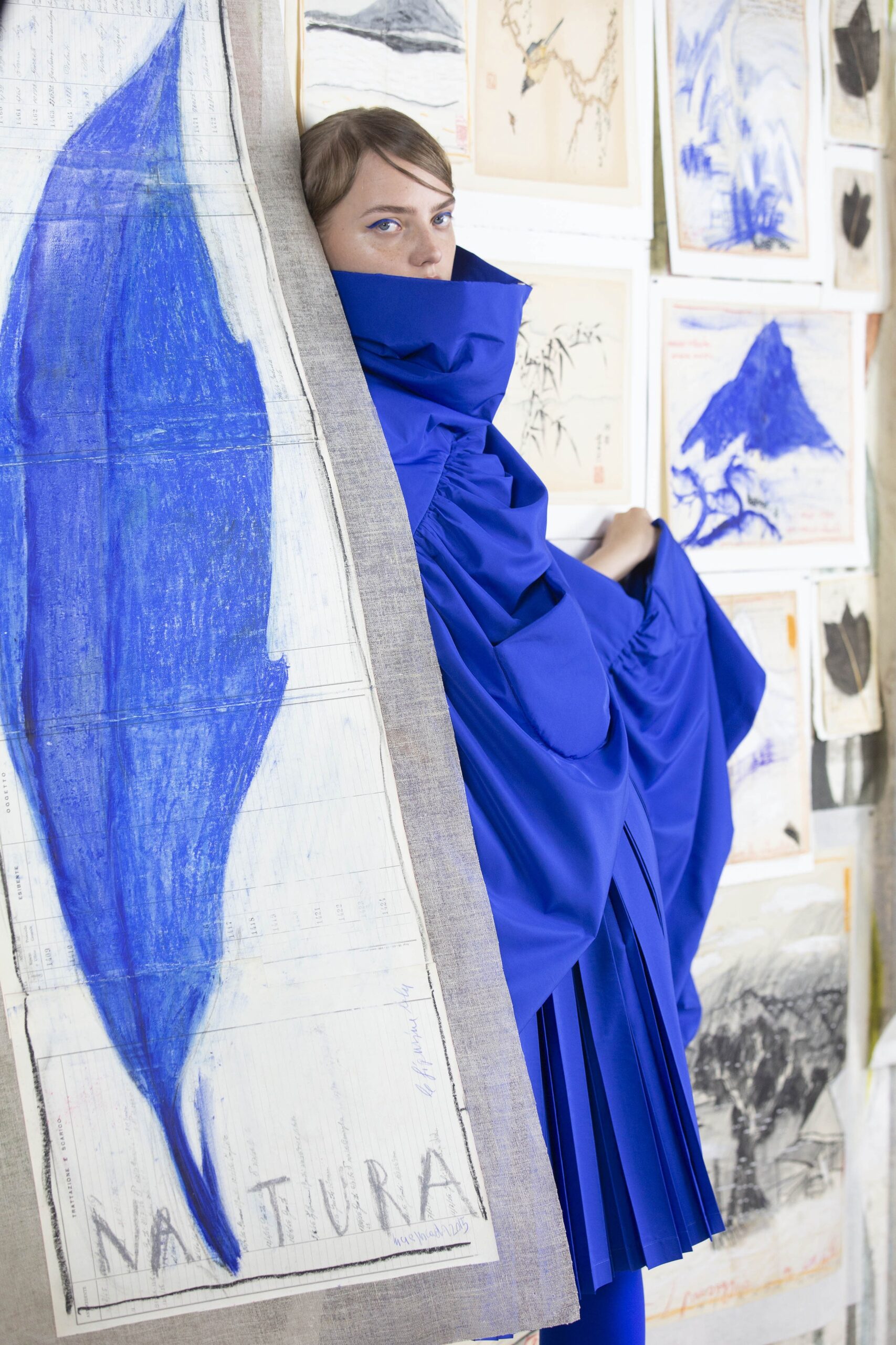 blue pleated midi dress with cape