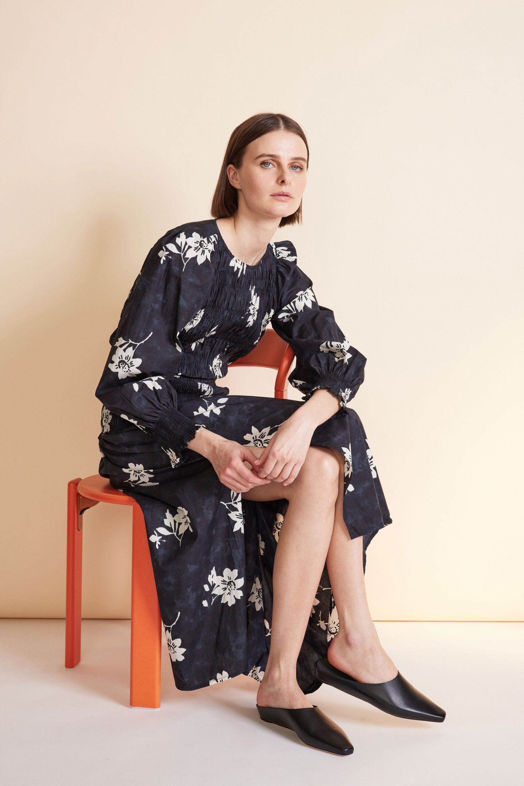 black floral midi dress with slip-on shoes