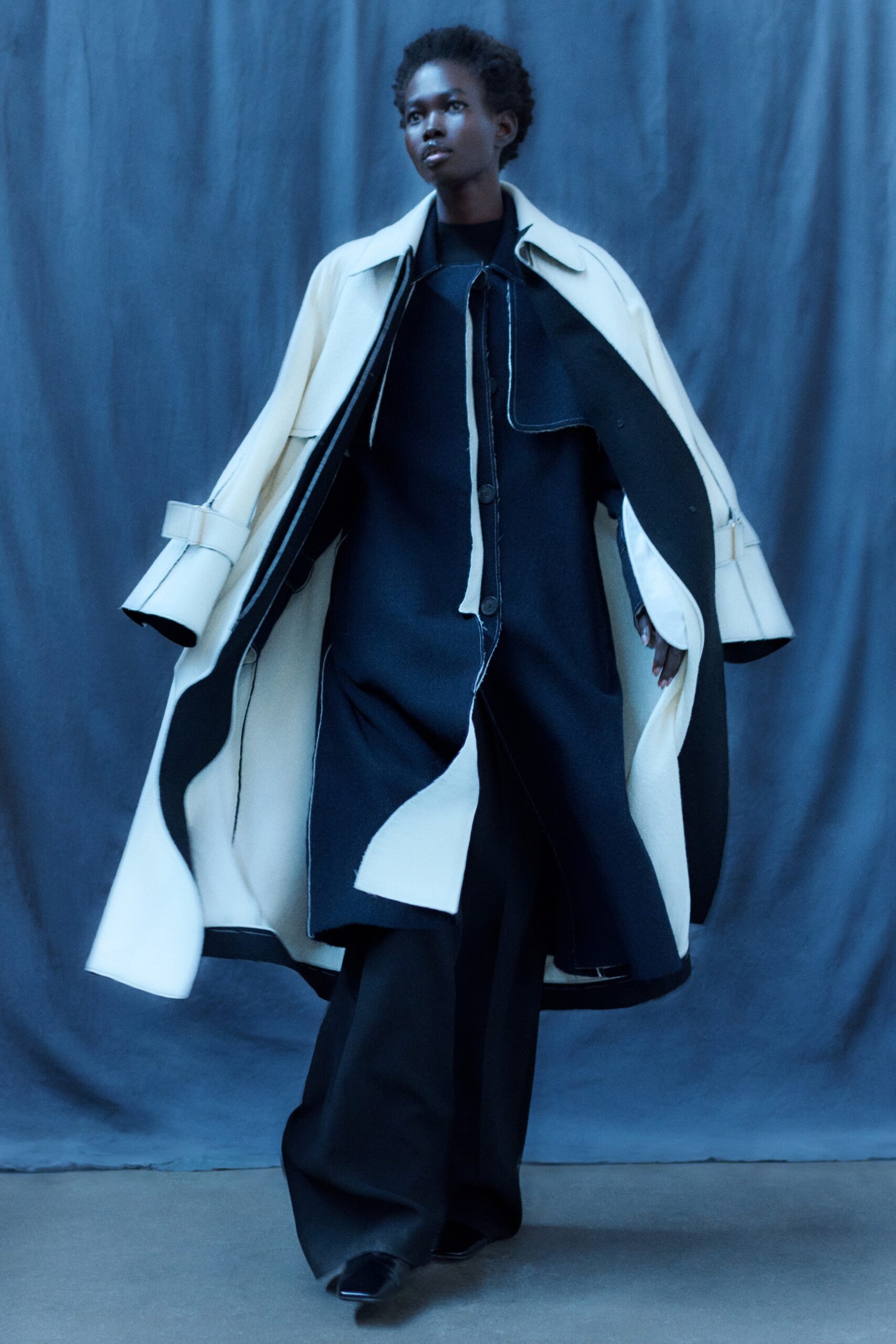 black wool long-sleeve collared oversized layered coat
