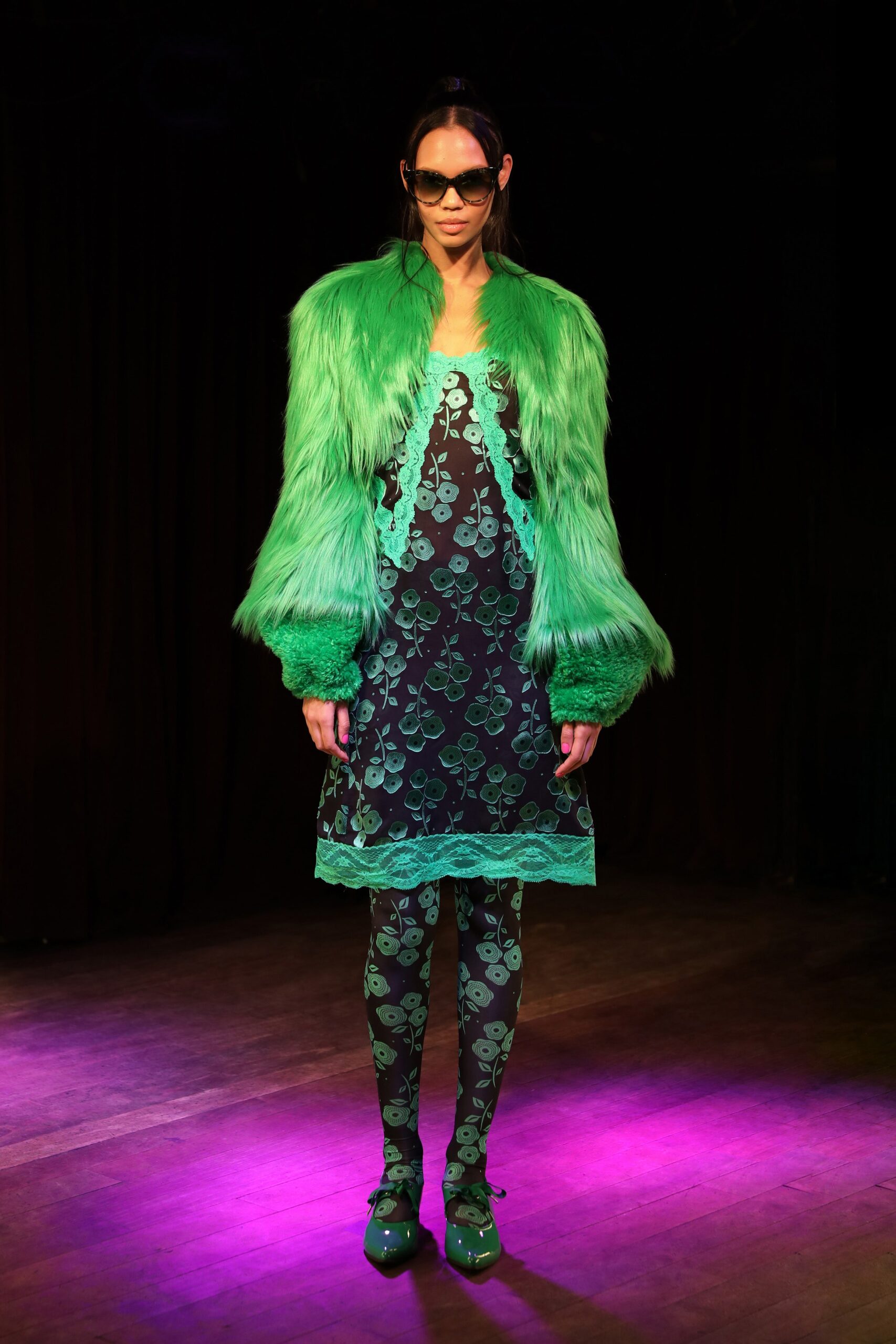 green faux-fur coat with black dress