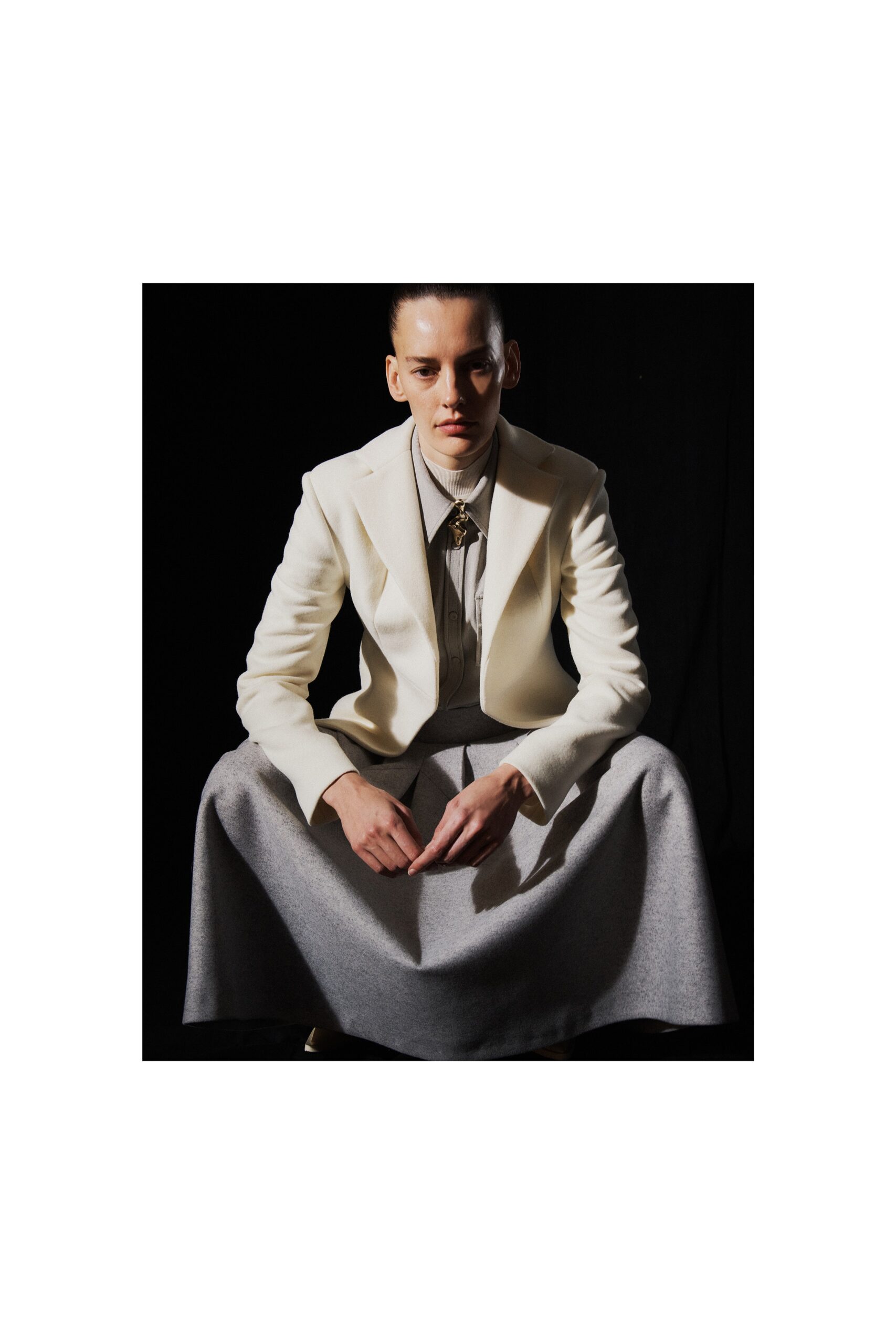 white tailored blazer with gray skirt