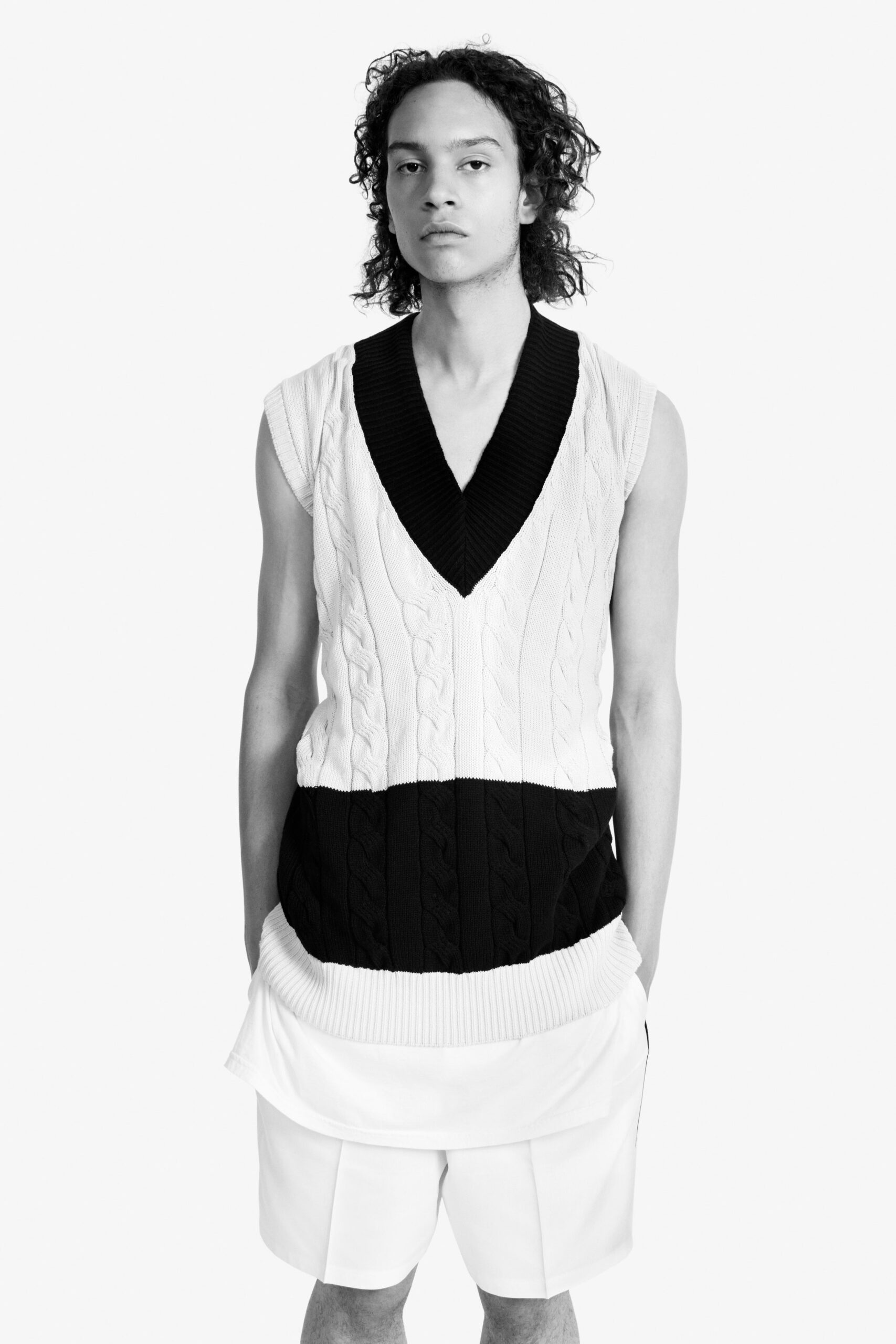 black and white sleeveless sweater with shorts