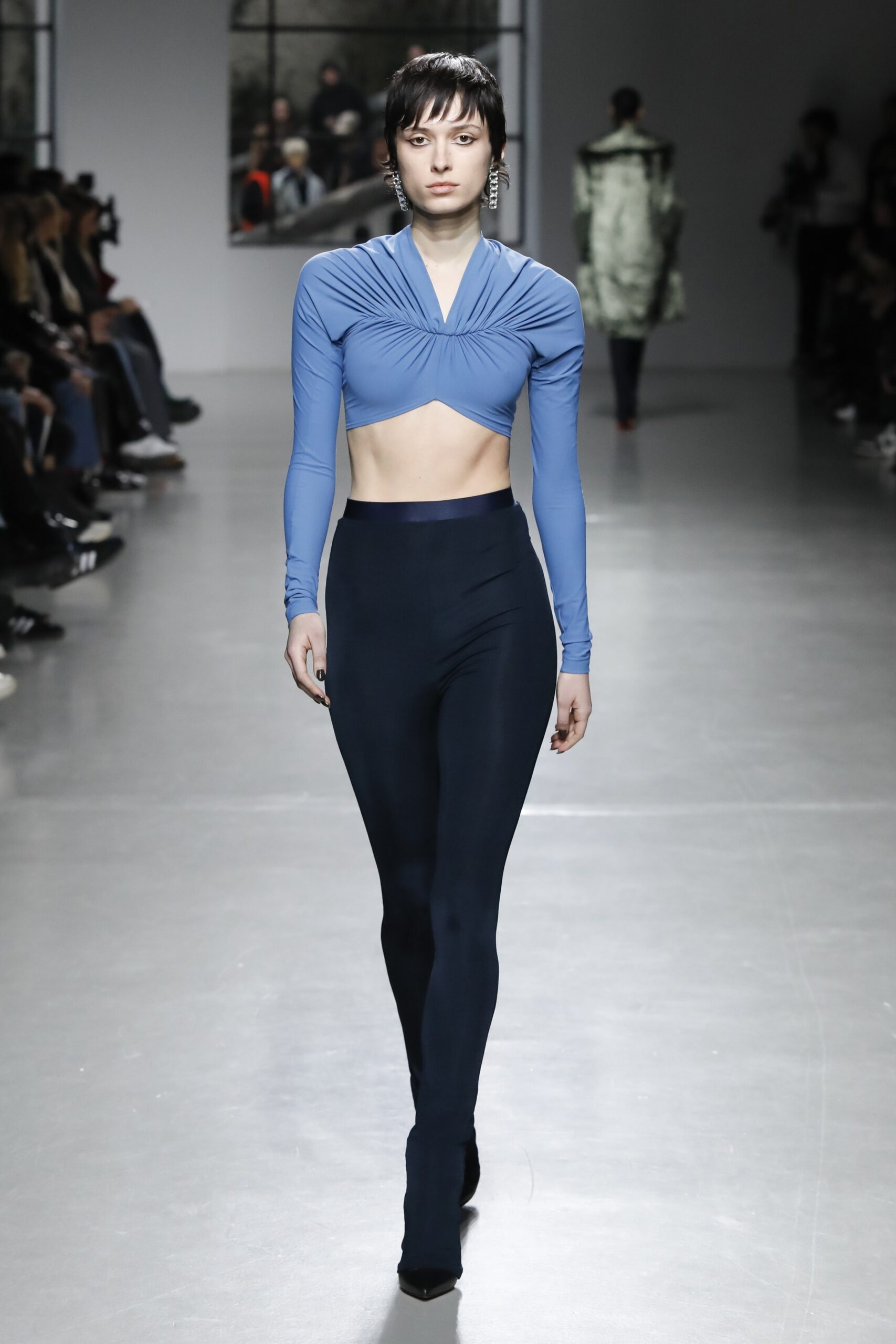 blue fitted top with black pants