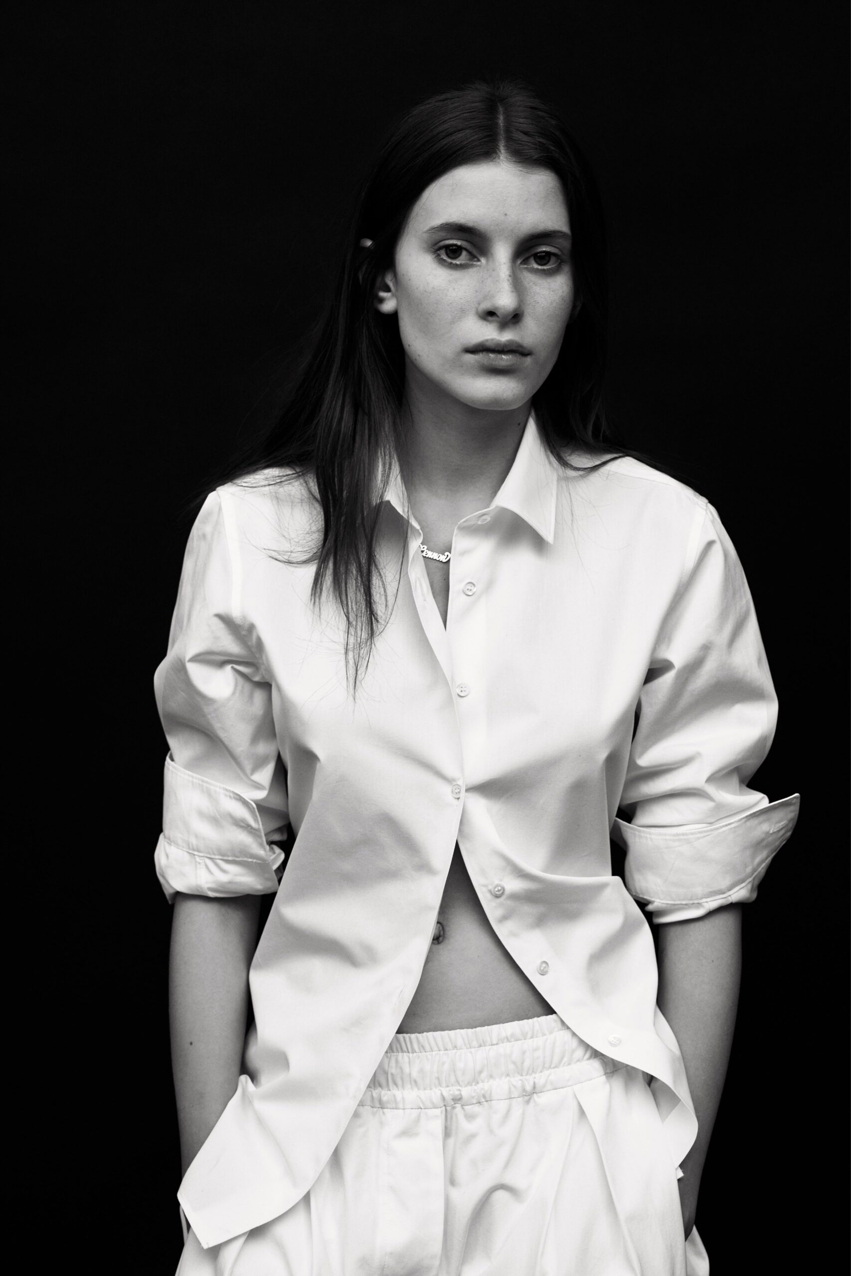 white relaxed shirt and pants