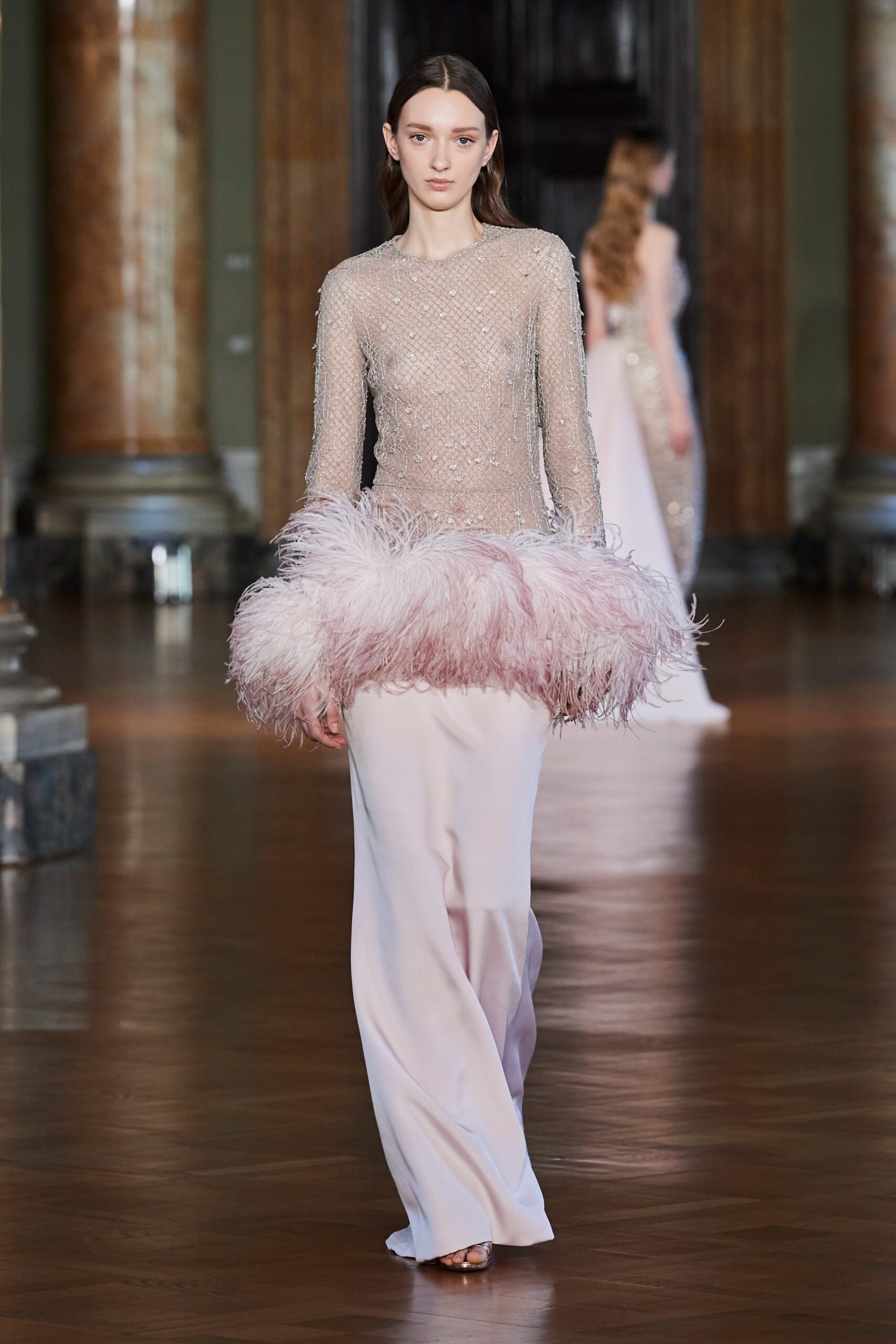 pink embellished gown with feather skirt