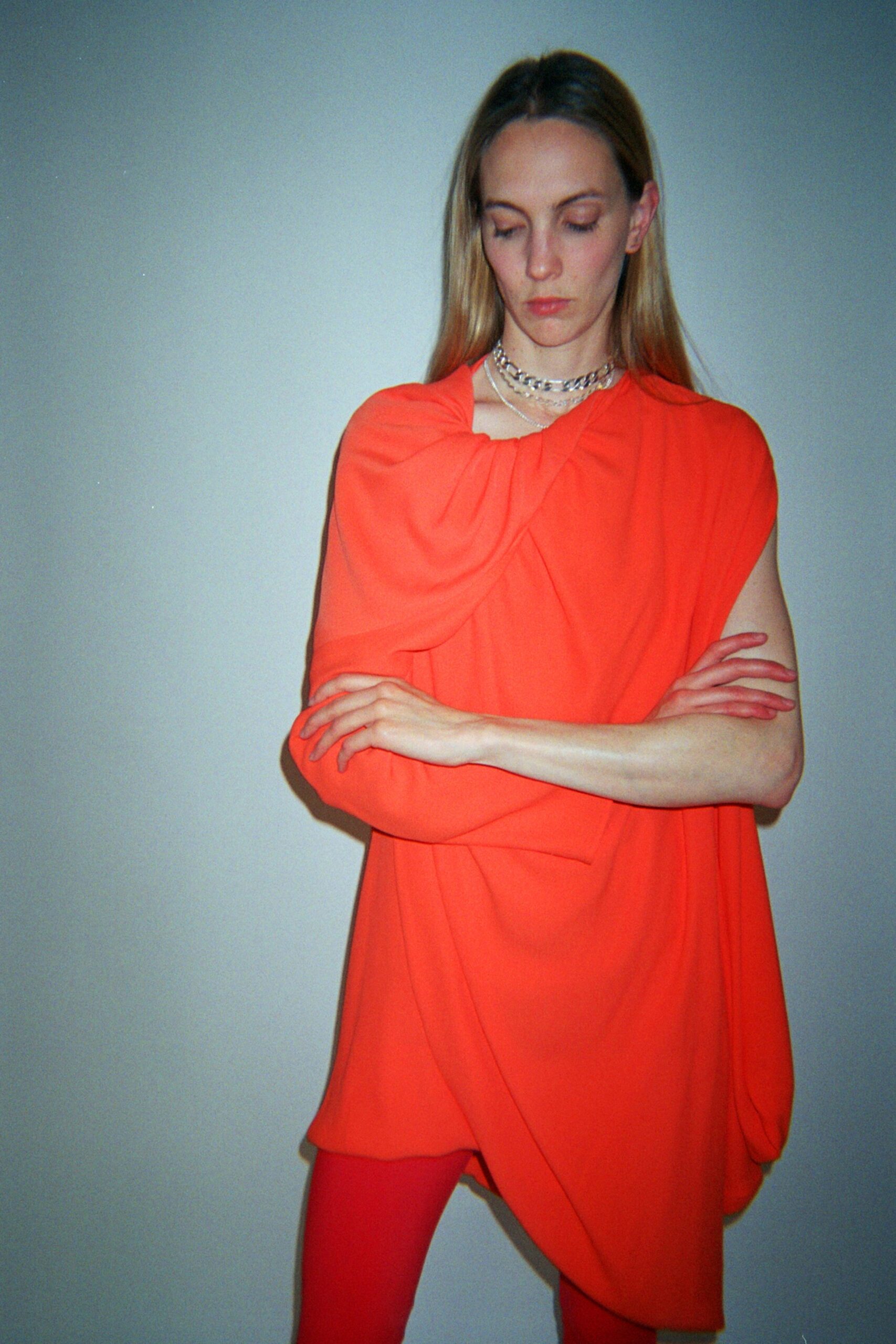 orange sleeveless asymmetric relaxed draped top