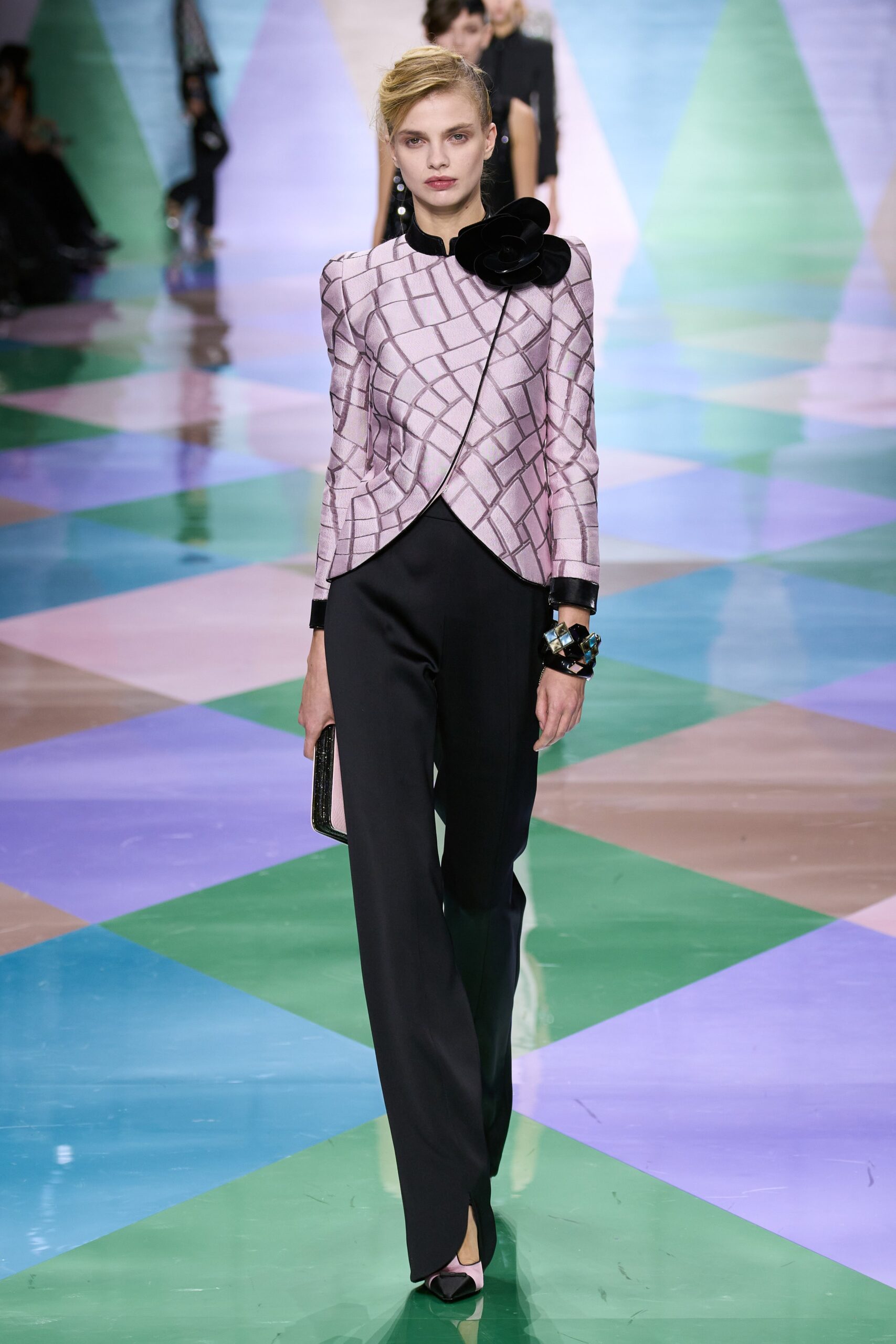 pink silk fitted jacket with black tailored pants